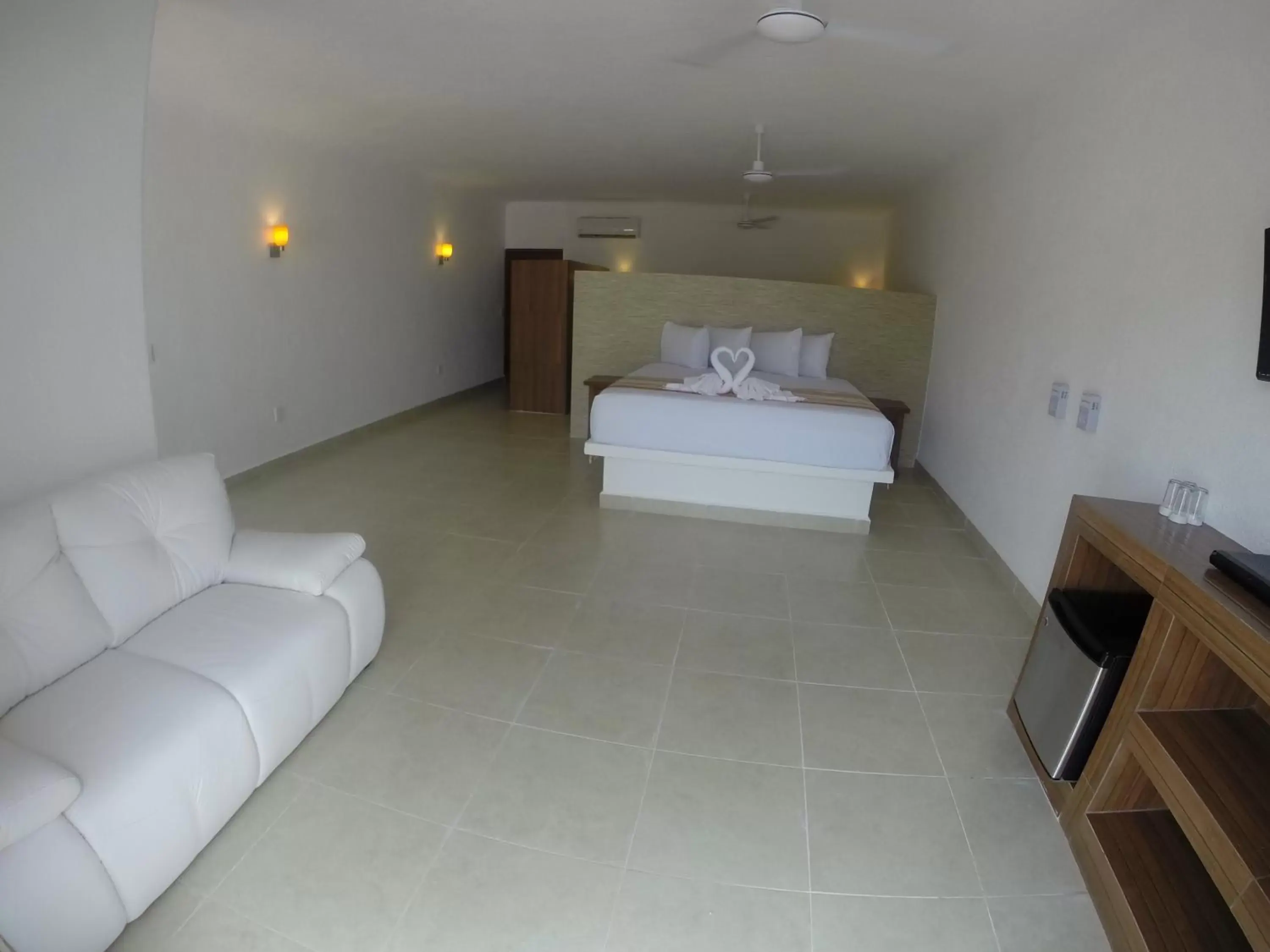 Bedroom, Bed in Pelicano Inn Playa del Carmen - Beachfront Hotel
