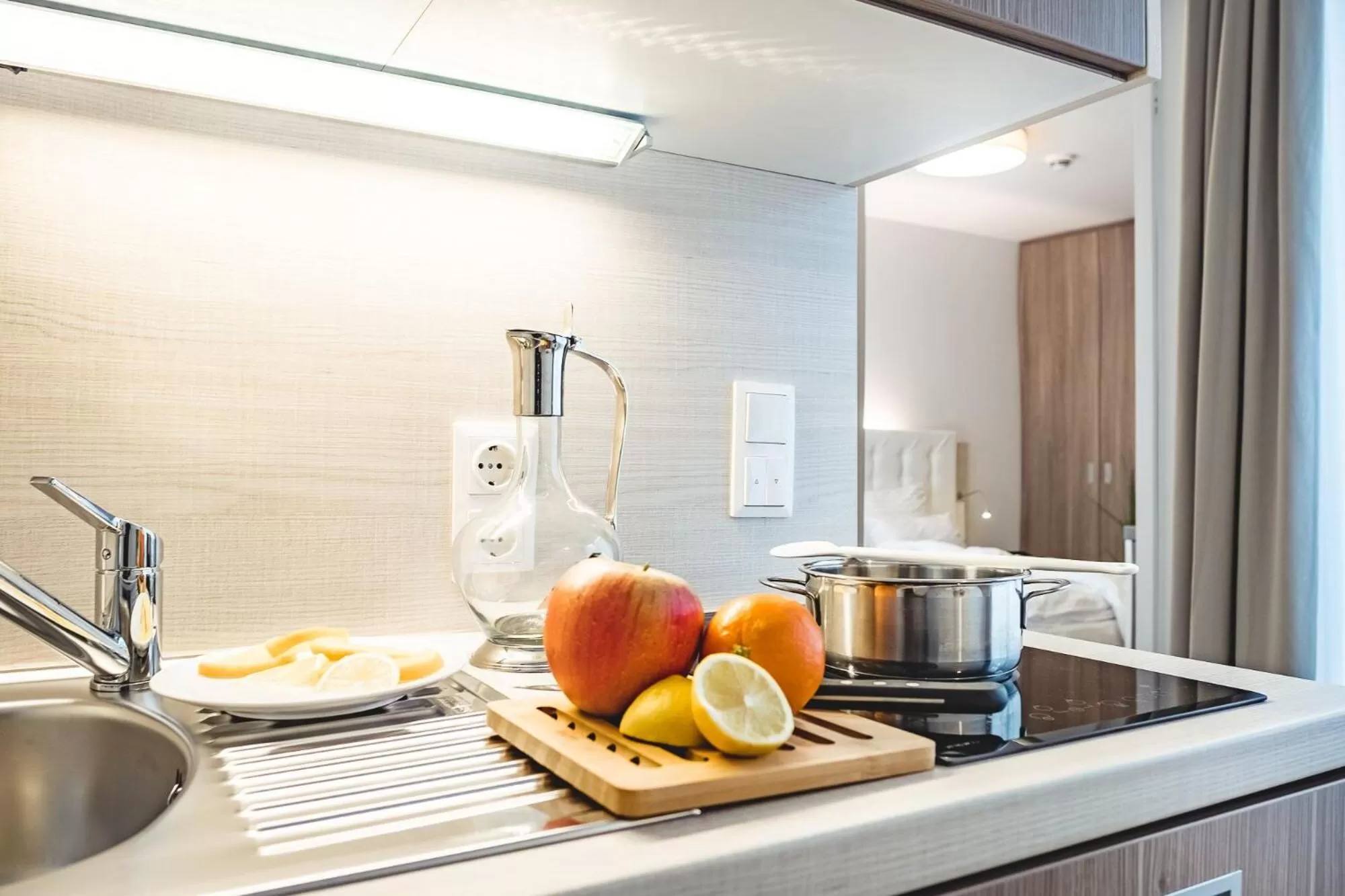 Kitchen or kitchenette in Oliver Apartments | contactless check-in