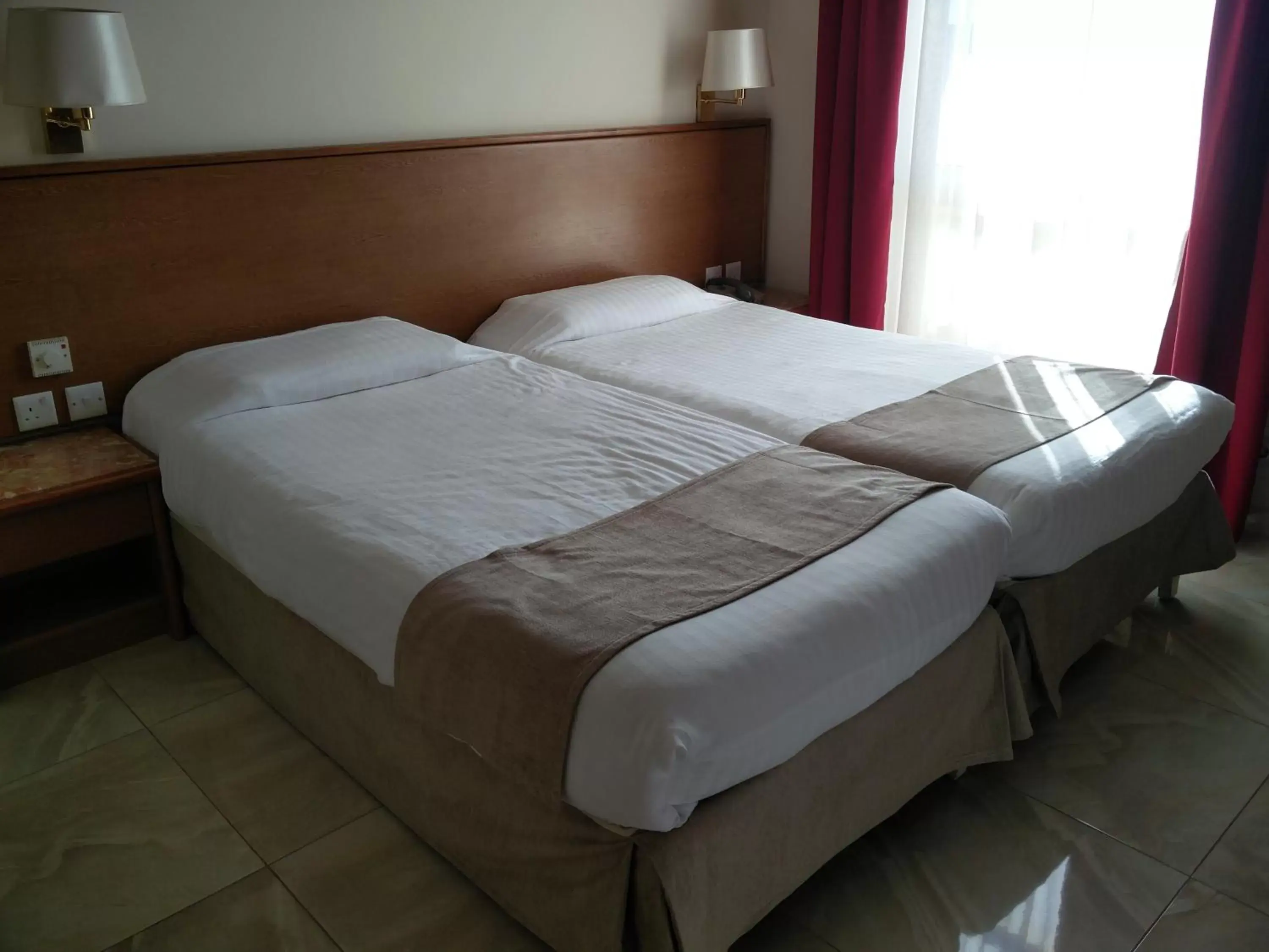 Bed in Allegro Hotel