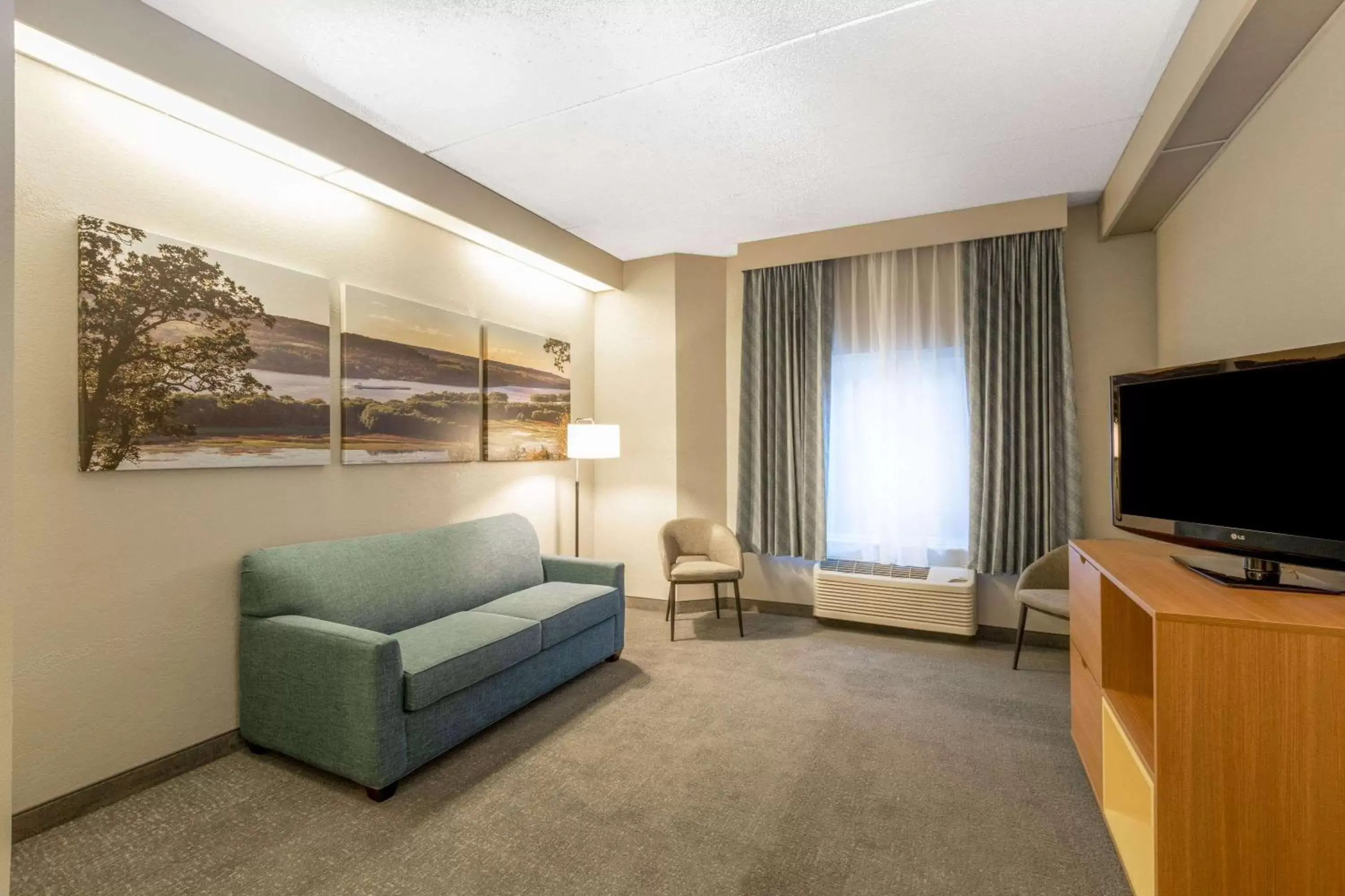 Photo of the whole room, TV/Entertainment Center in Days Inn by Wyndham Eagan Minnesota Near Mall of America