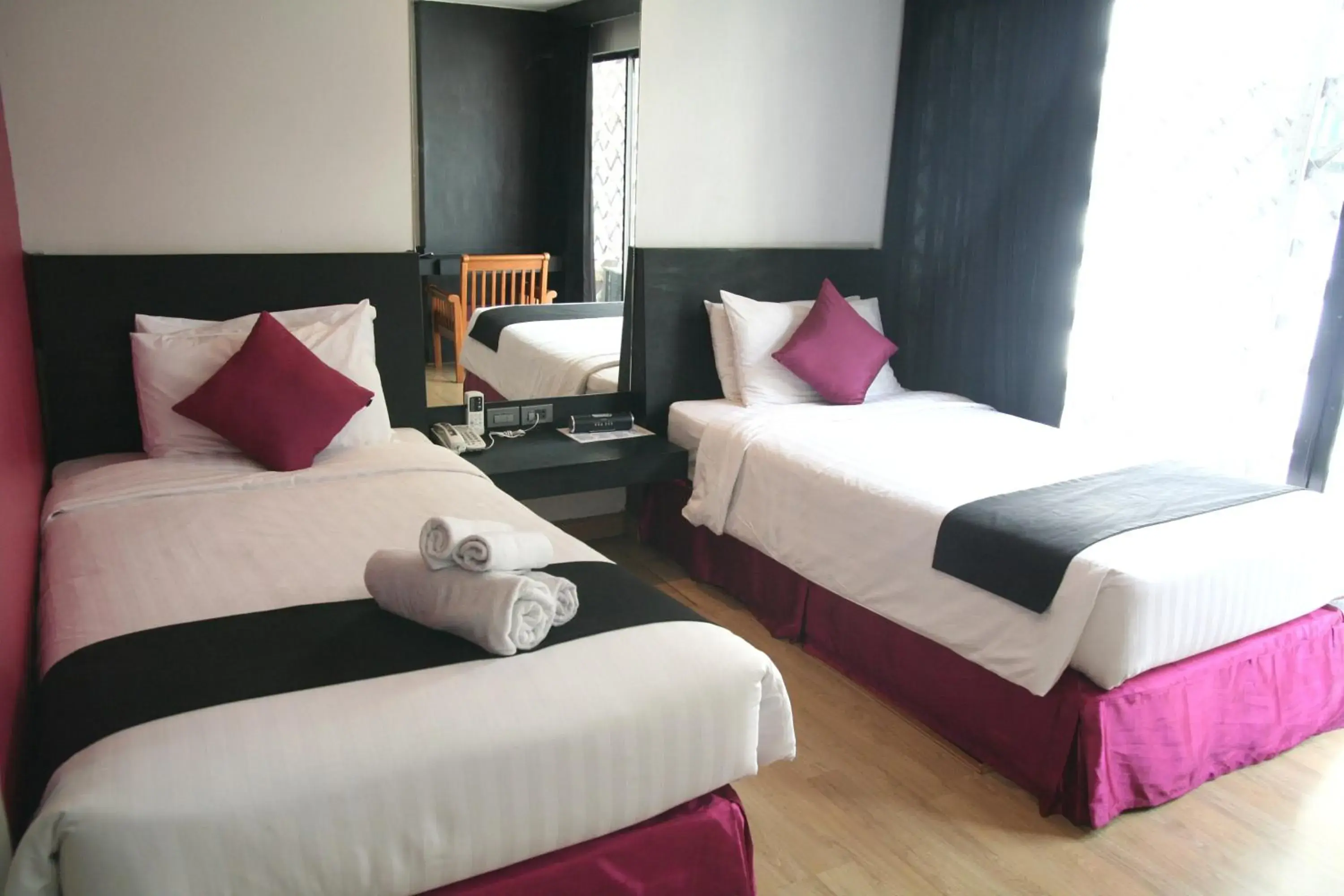 Bed in Grand Inn Hotel