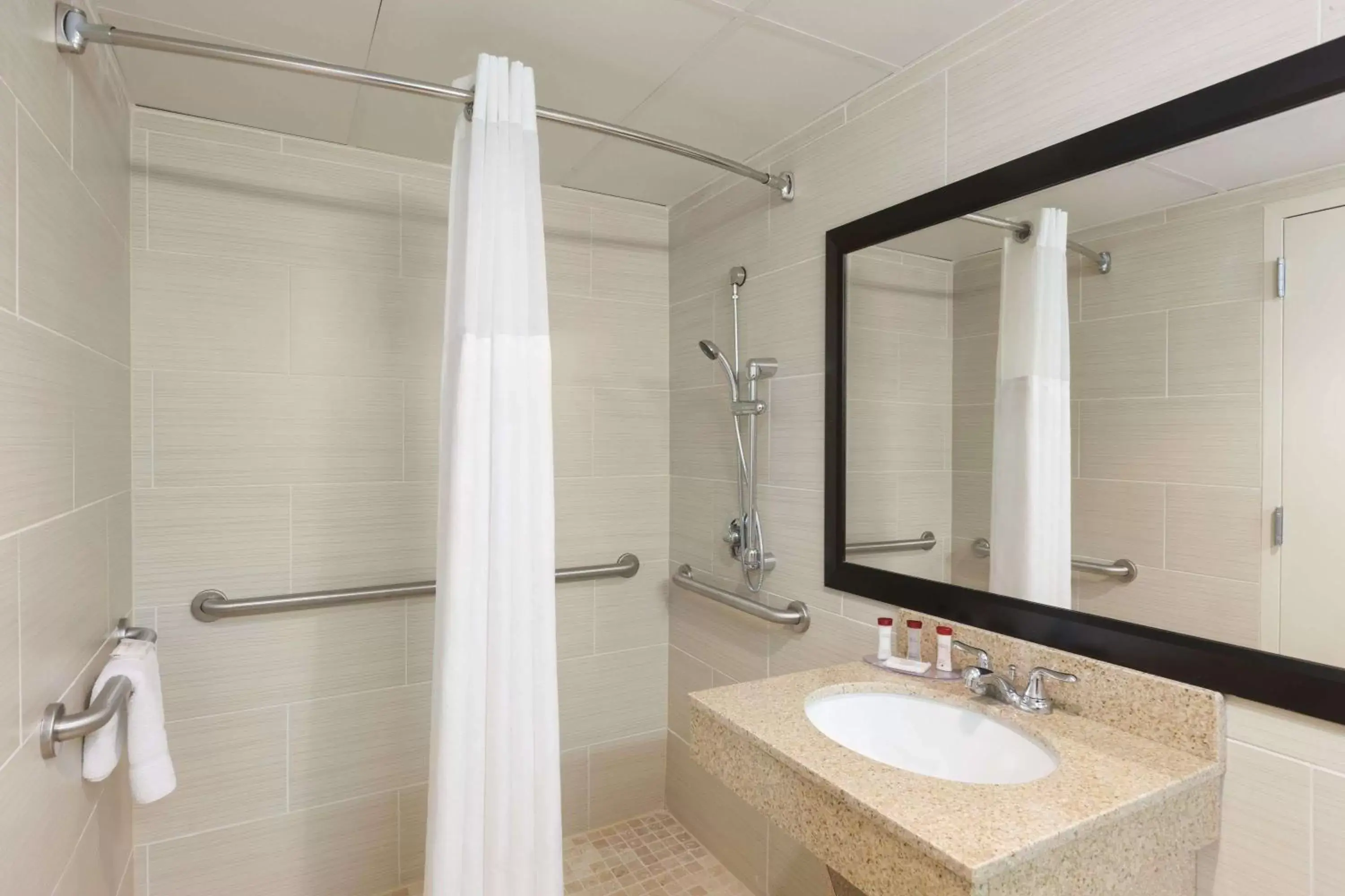 Bathroom in Ramada by Wyndham Rochelle Park Near Paramus