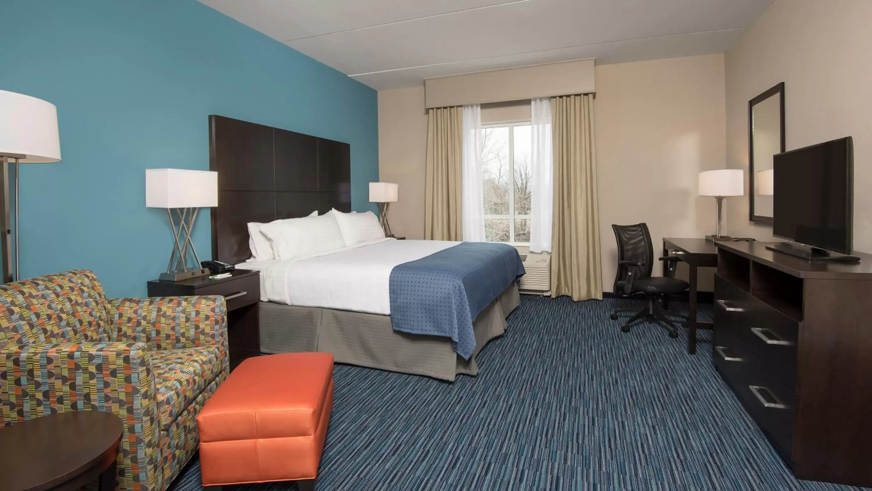 Photo of the whole room, TV/Entertainment Center in Holiday Inn Indianapolis Airport, an IHG Hotel