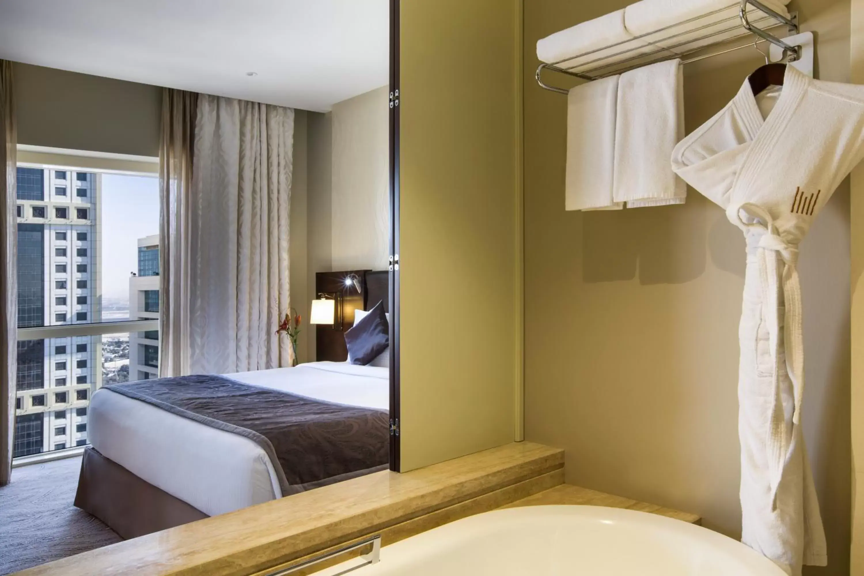 Shower, Bed in The Tower Plaza Hotel Dubai