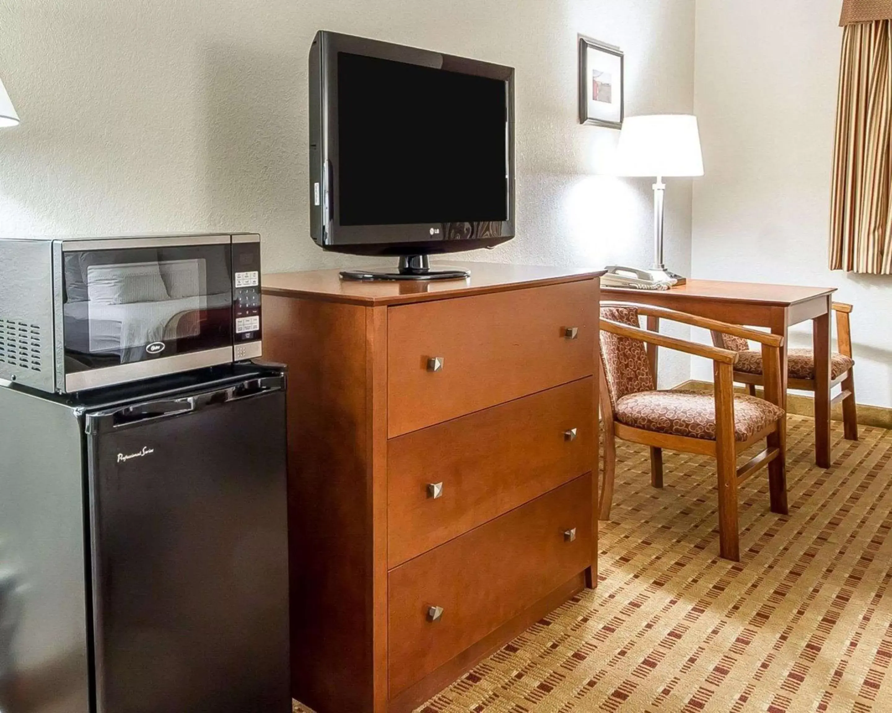 Photo of the whole room, TV/Entertainment Center in Quality Inn & Suites