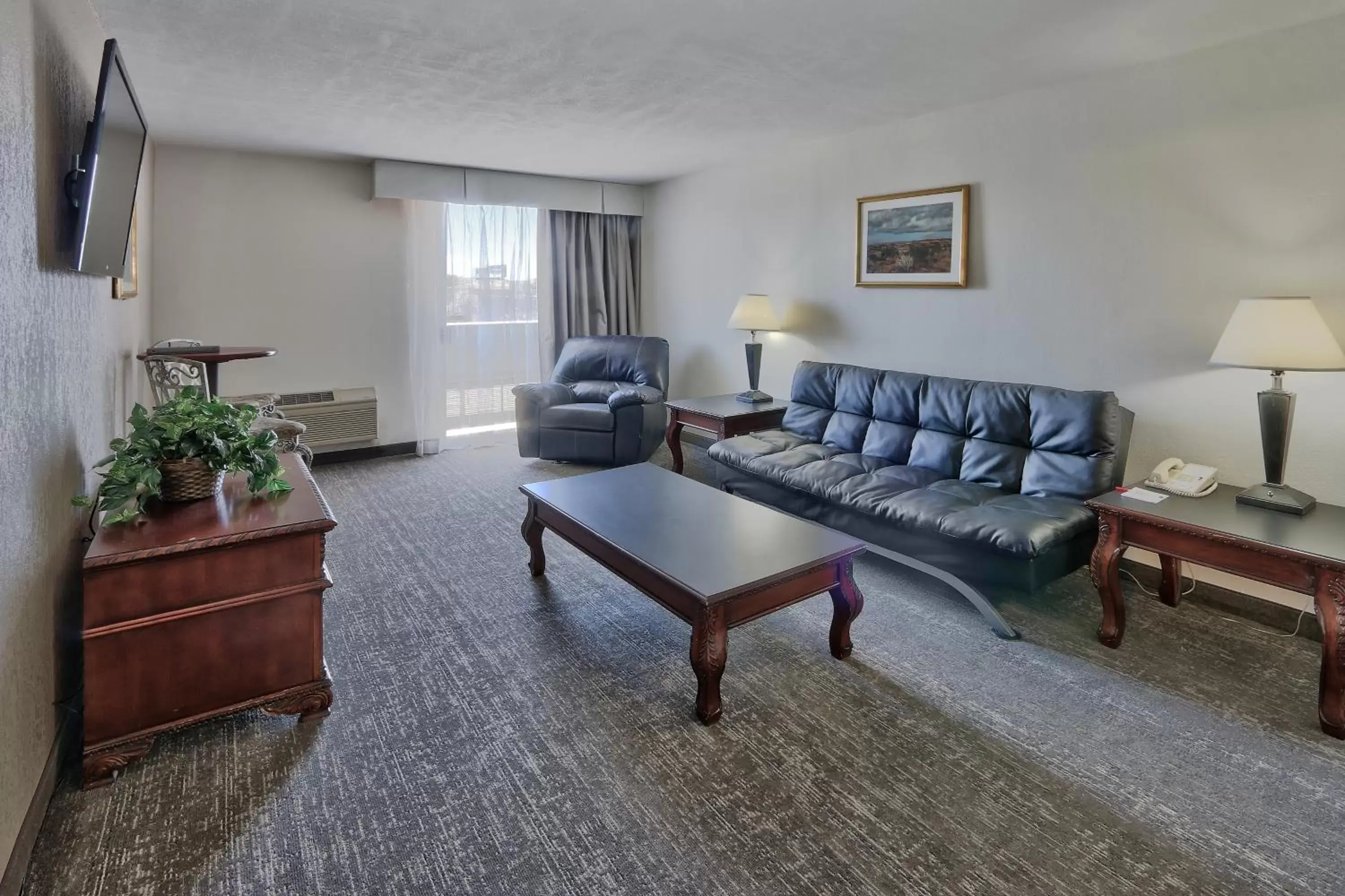 Living room, Seating Area in Ramada by Wyndham Albuquerque Midtown