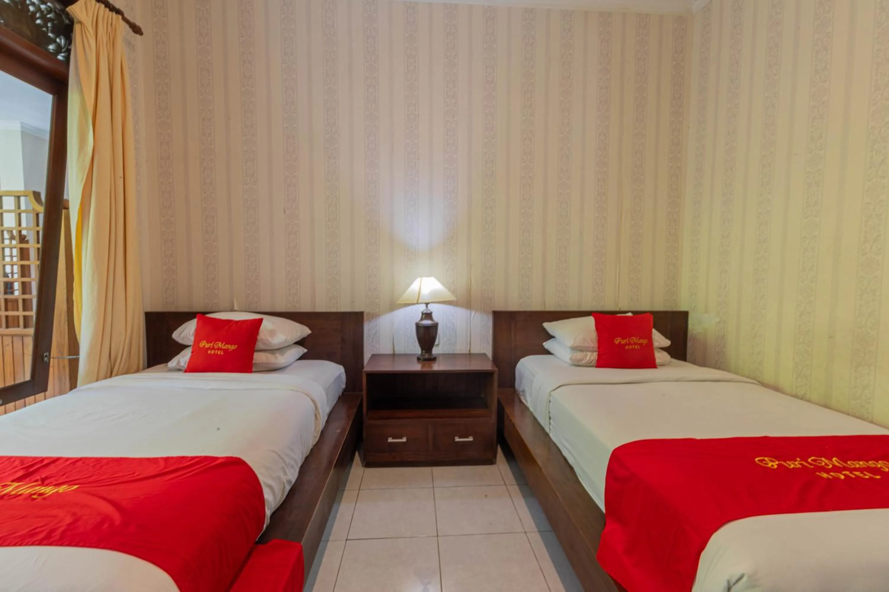 Bedroom in Puri Mango Guest House Sanur