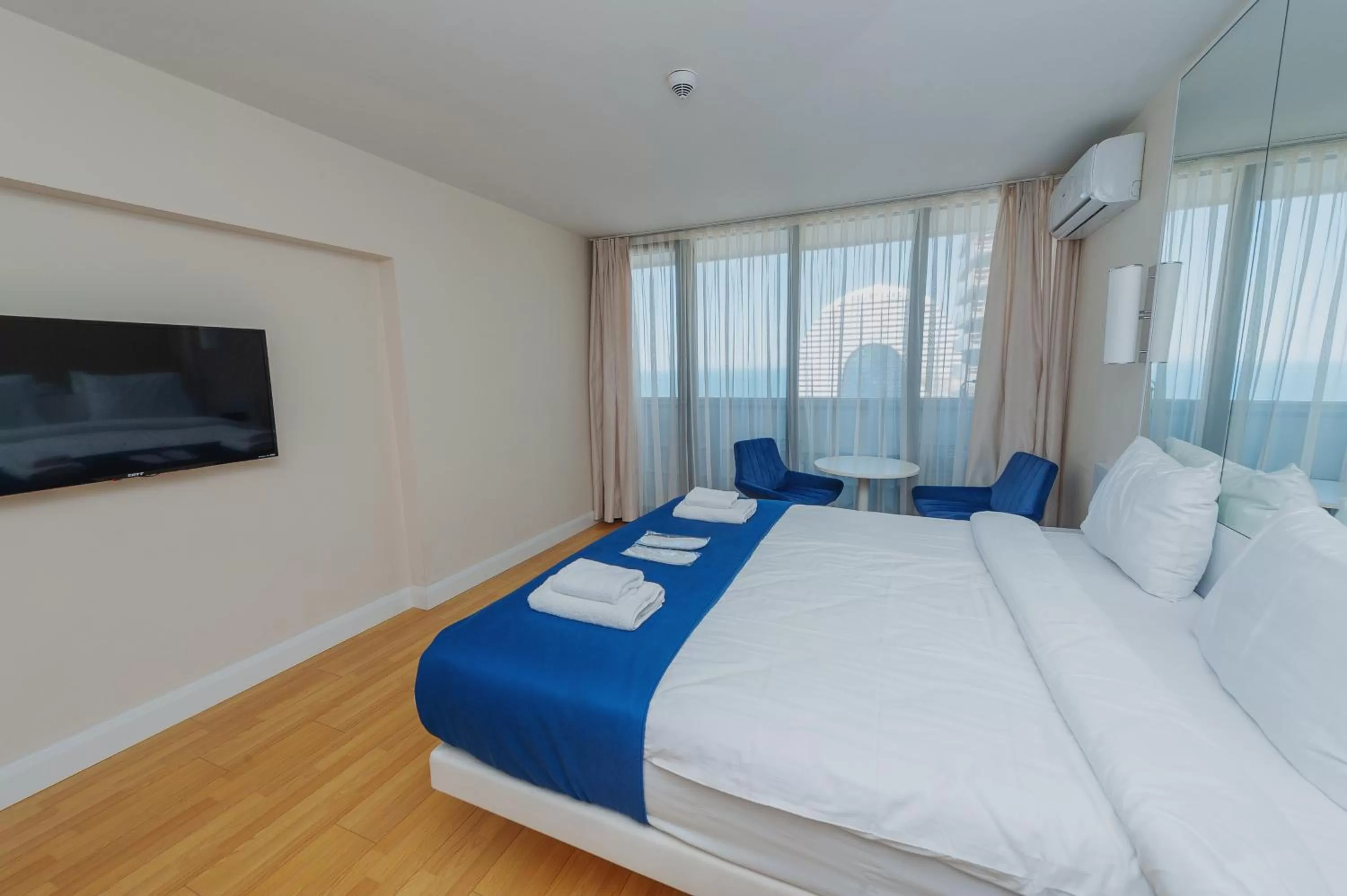 Bed in Orbi City Luxury Suite