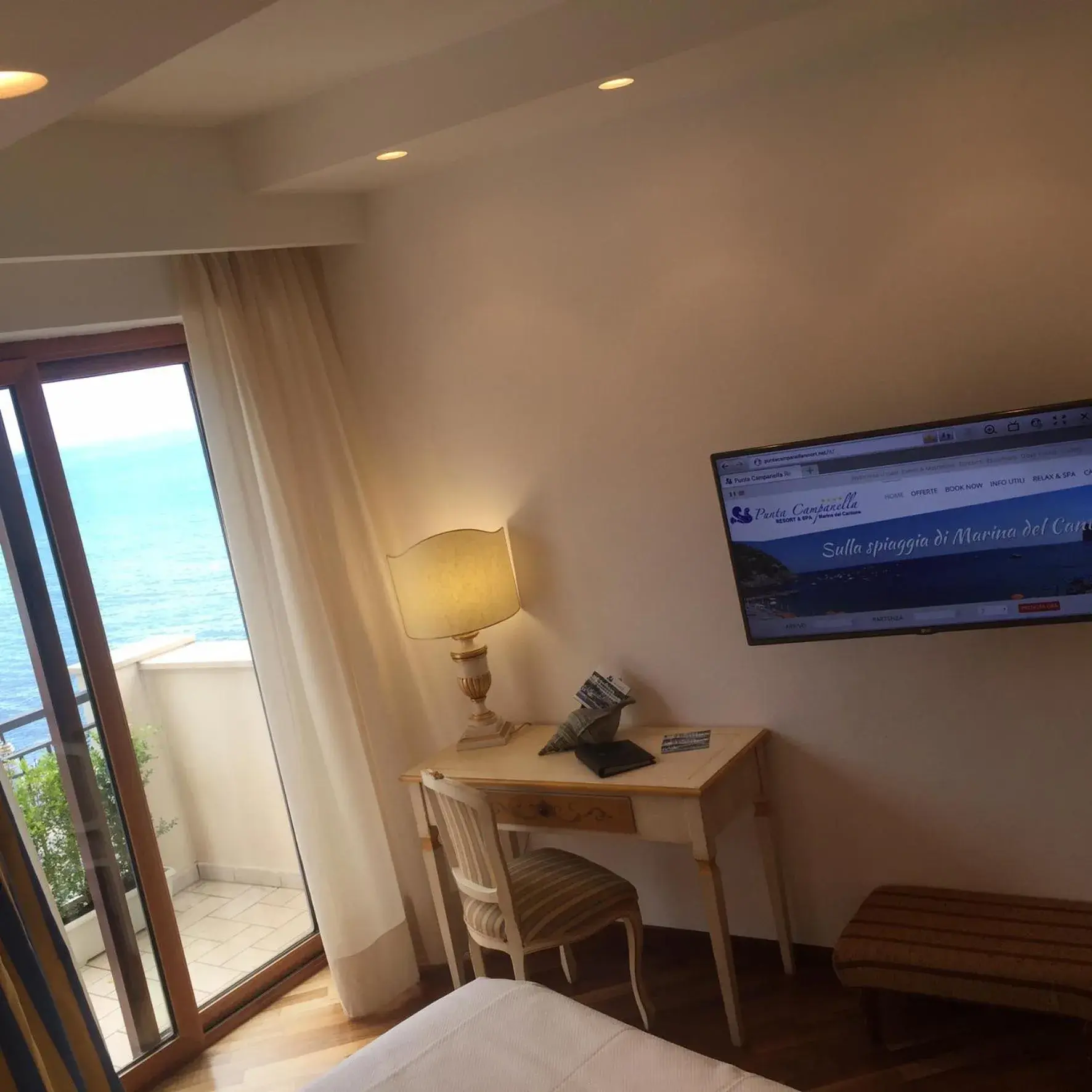 Bedroom, TV/Entertainment Center in Punta Campanella Resort & Spa