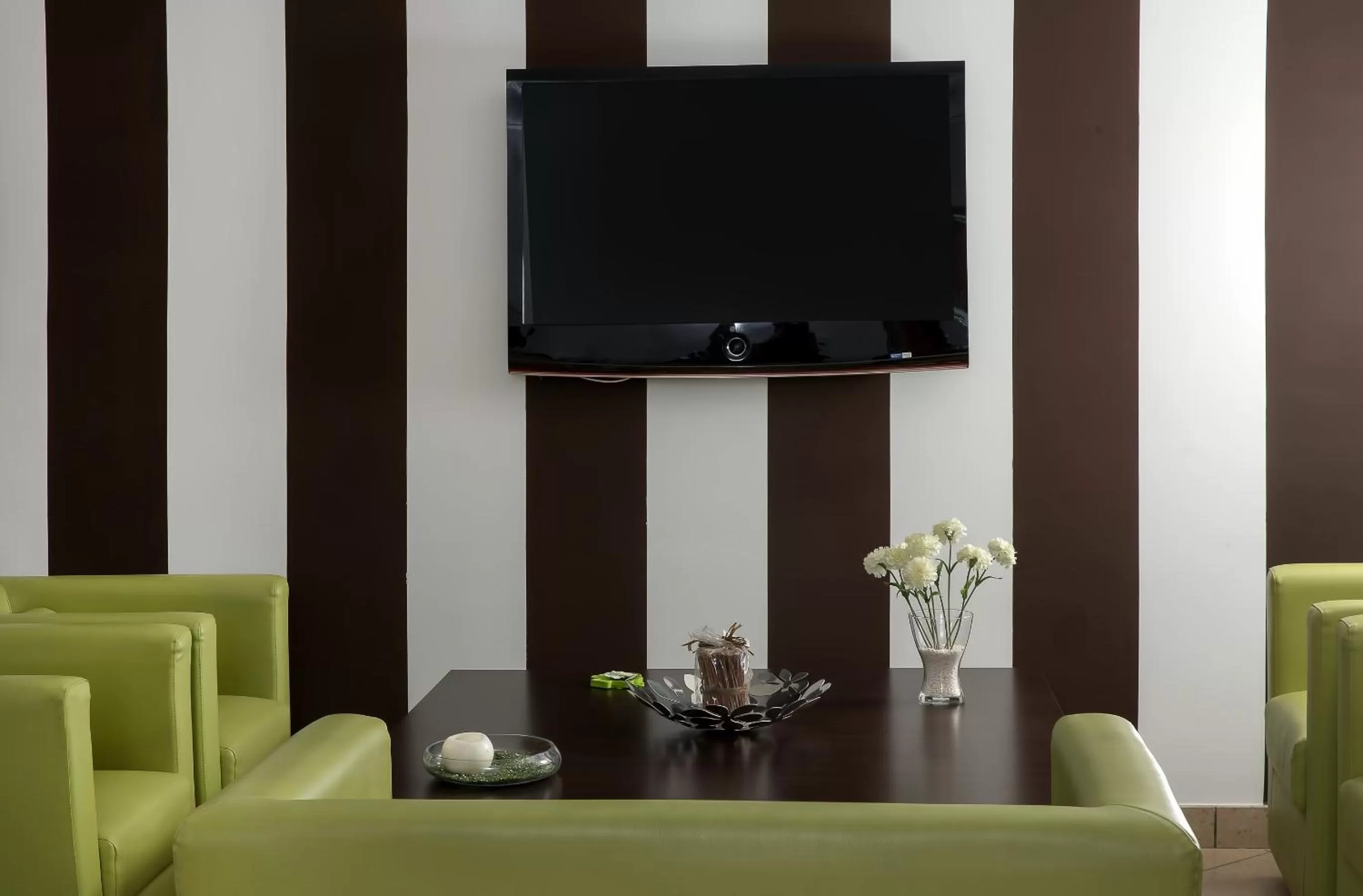 Communal lounge/ TV room in De Maria House