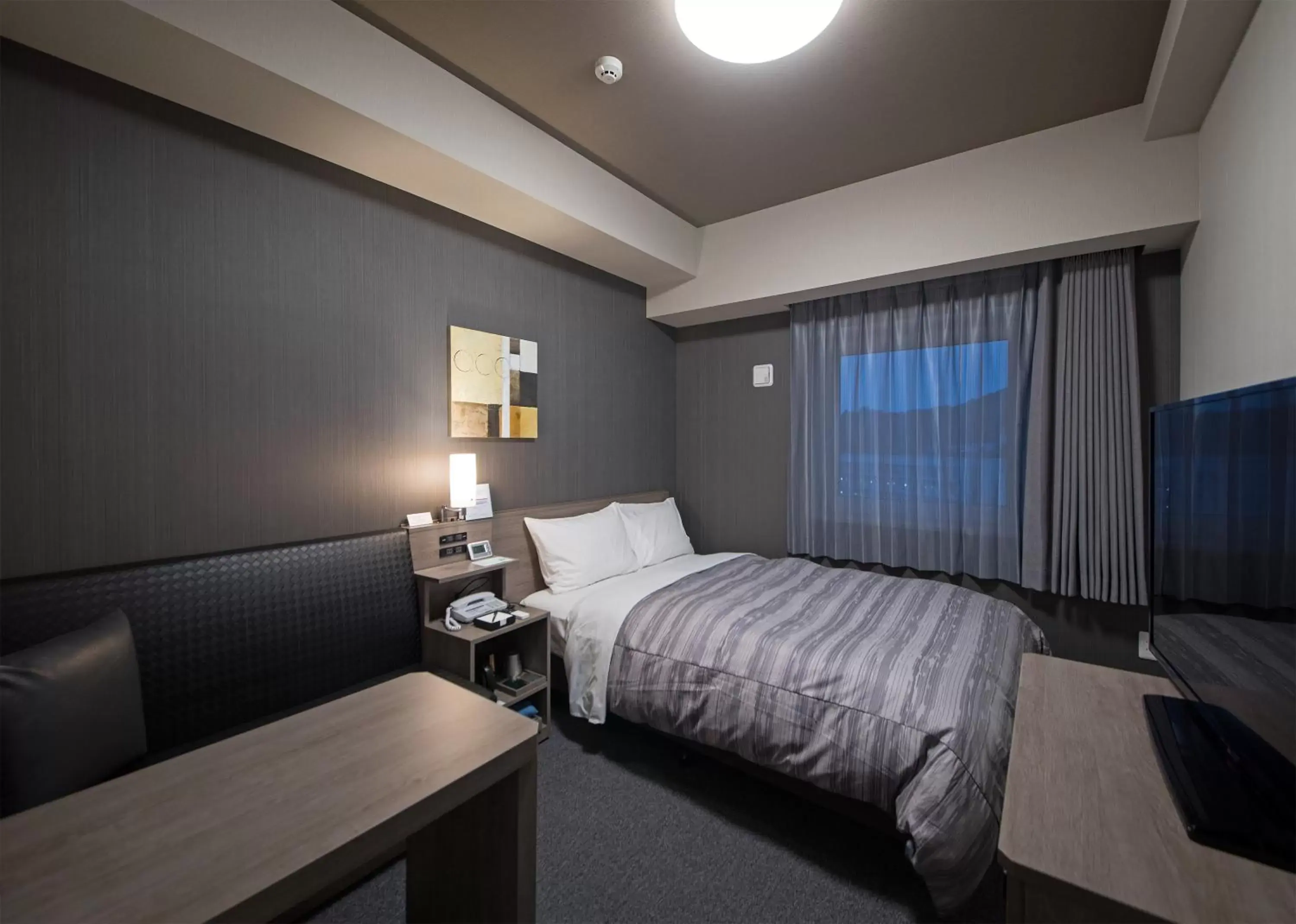 Photo of the whole room, Bed in Hotel Route-Inn Hamada Ekimae Photo of the whole room, Bed in Hotel Route-Inn Hamada Ekimae