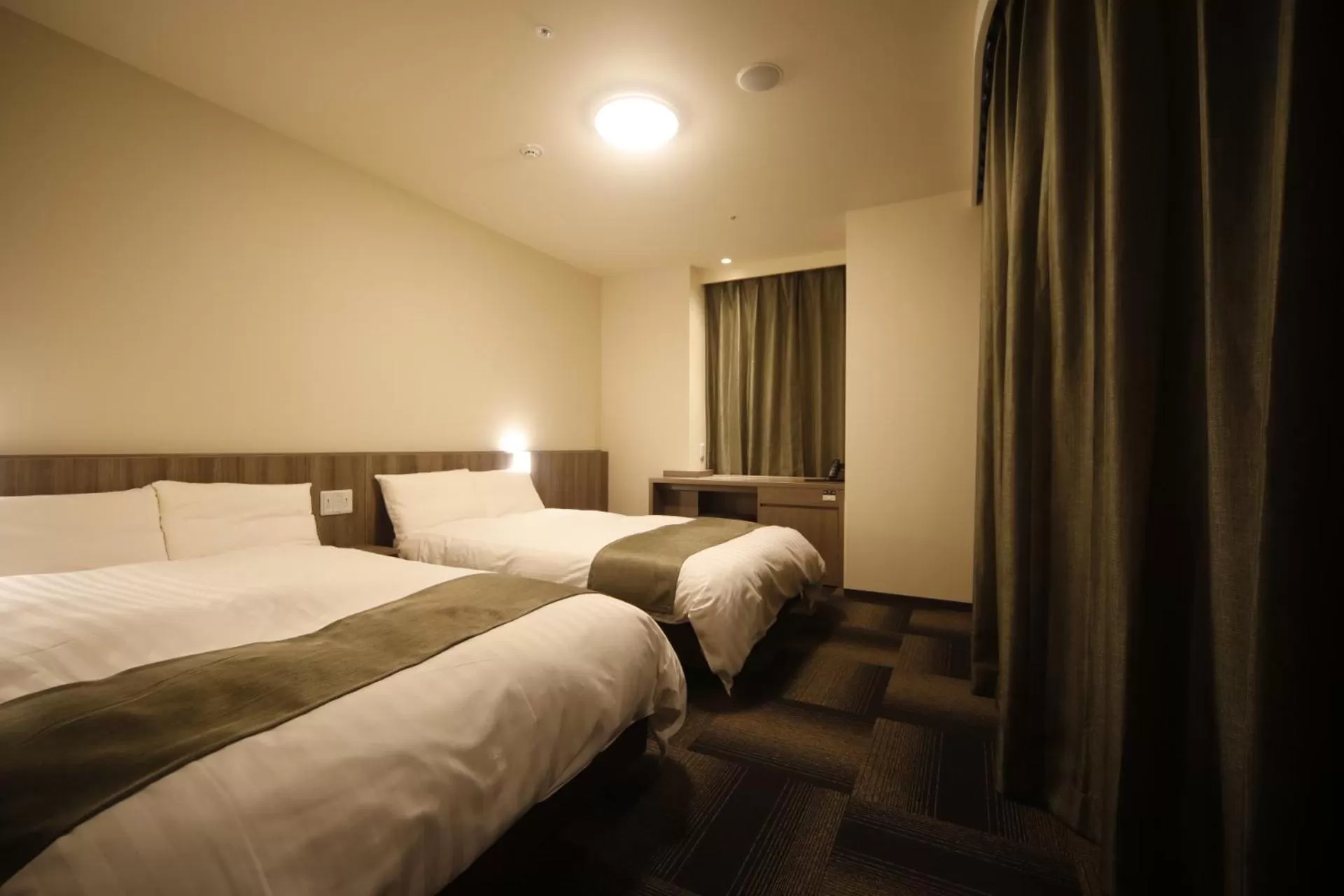 Bed in Dormy Inn Korakuen