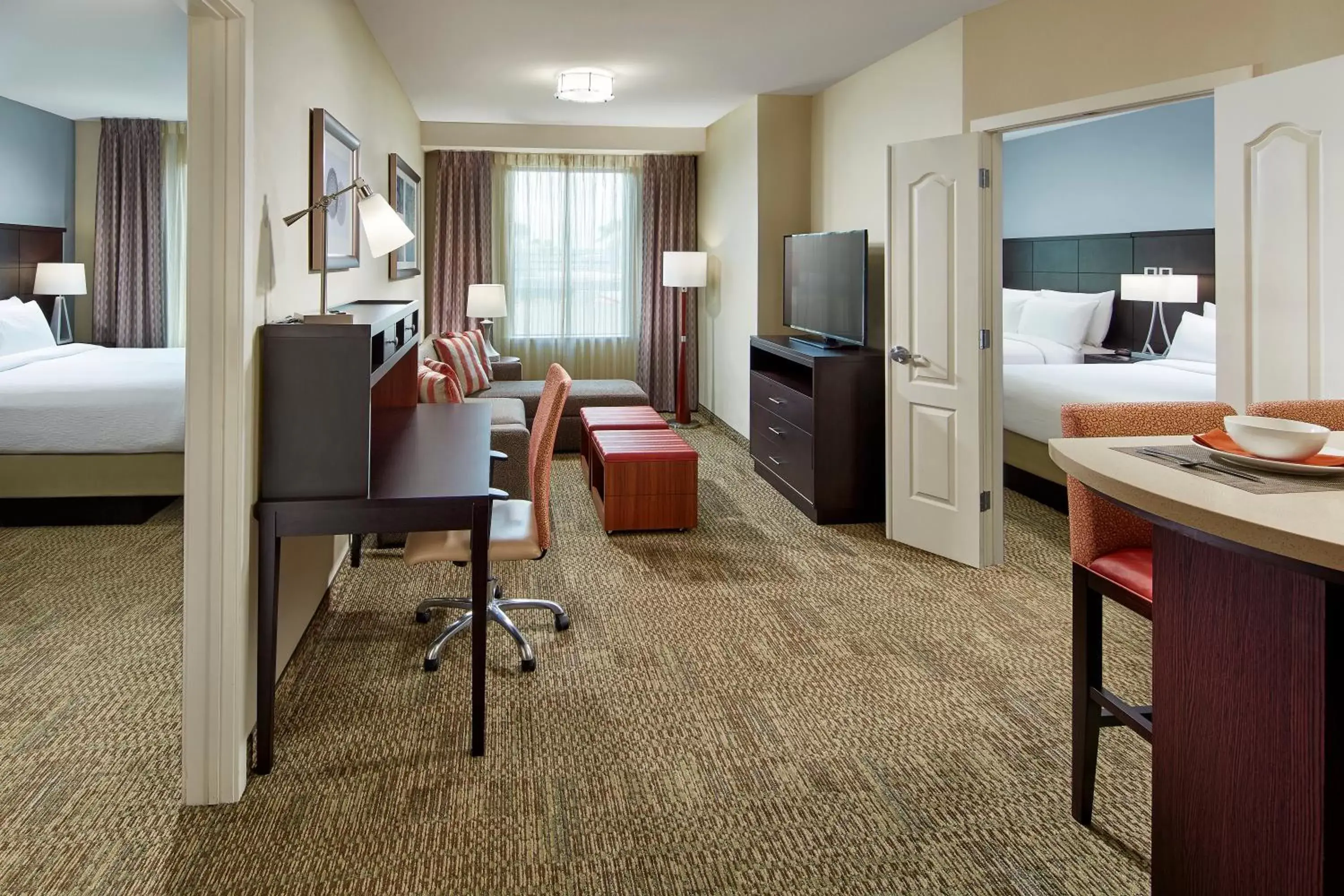 Photo of the whole room, TV/Entertainment Center in Staybridge Suites Anaheim At The Park, an IHG Hotel