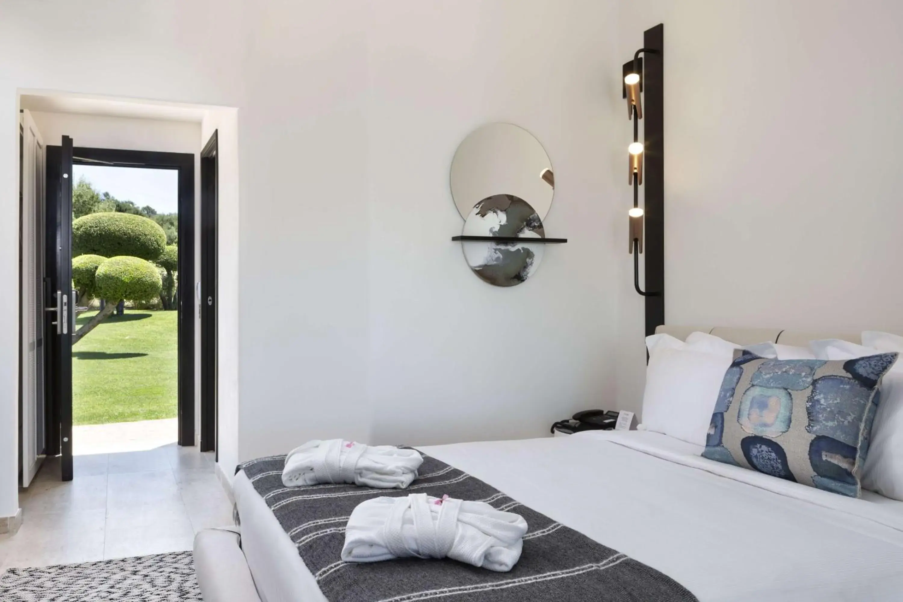Bed in Sulia House Porto Rotondo, Curio Collection by Hilton