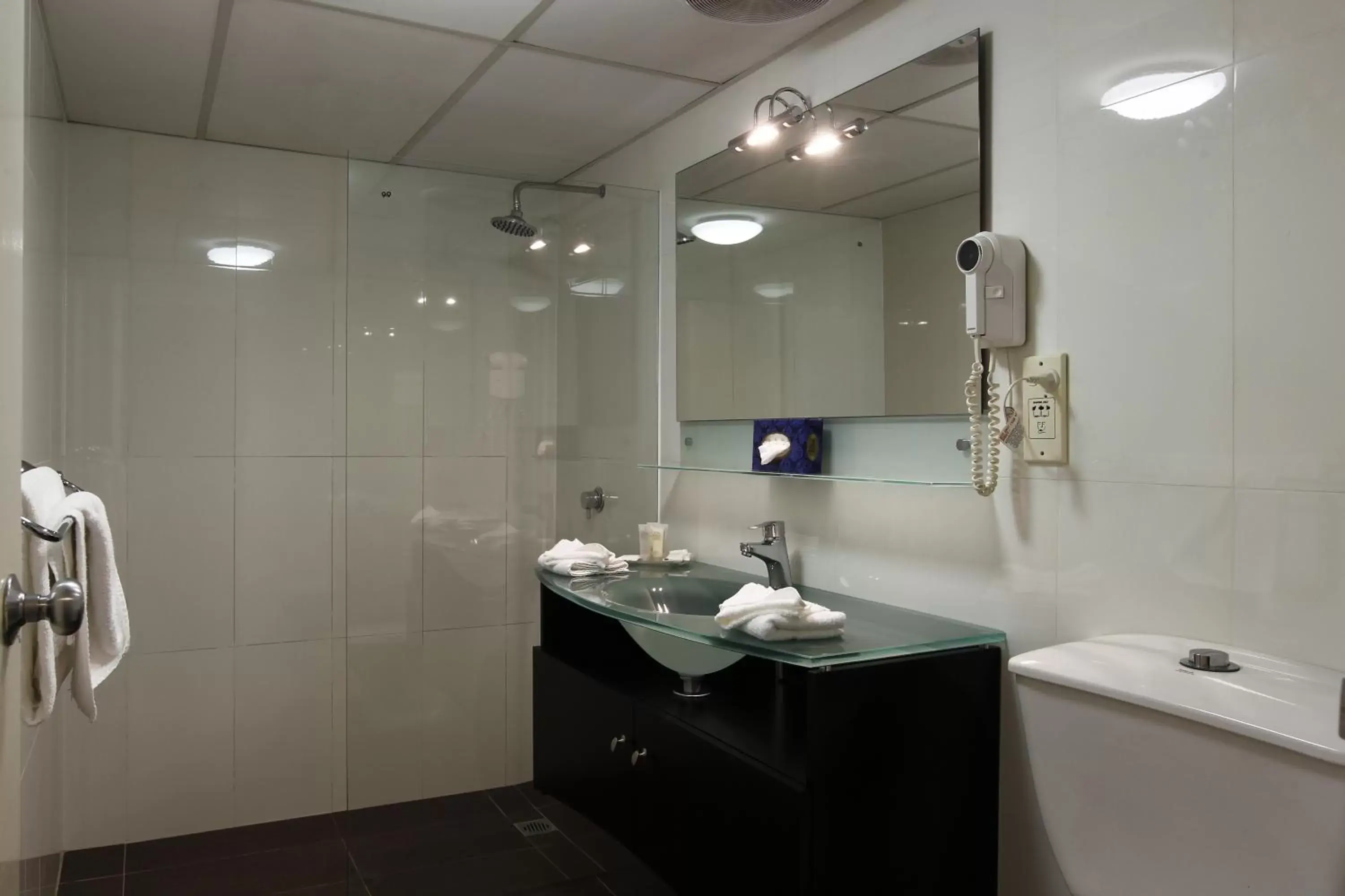 Bathroom in Ramada Hotel & Suites by Wyndham Cabramatta