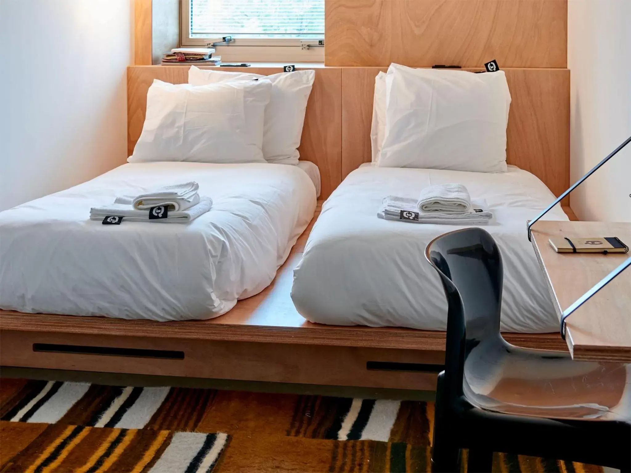 Bed in Q-Factory Hotel