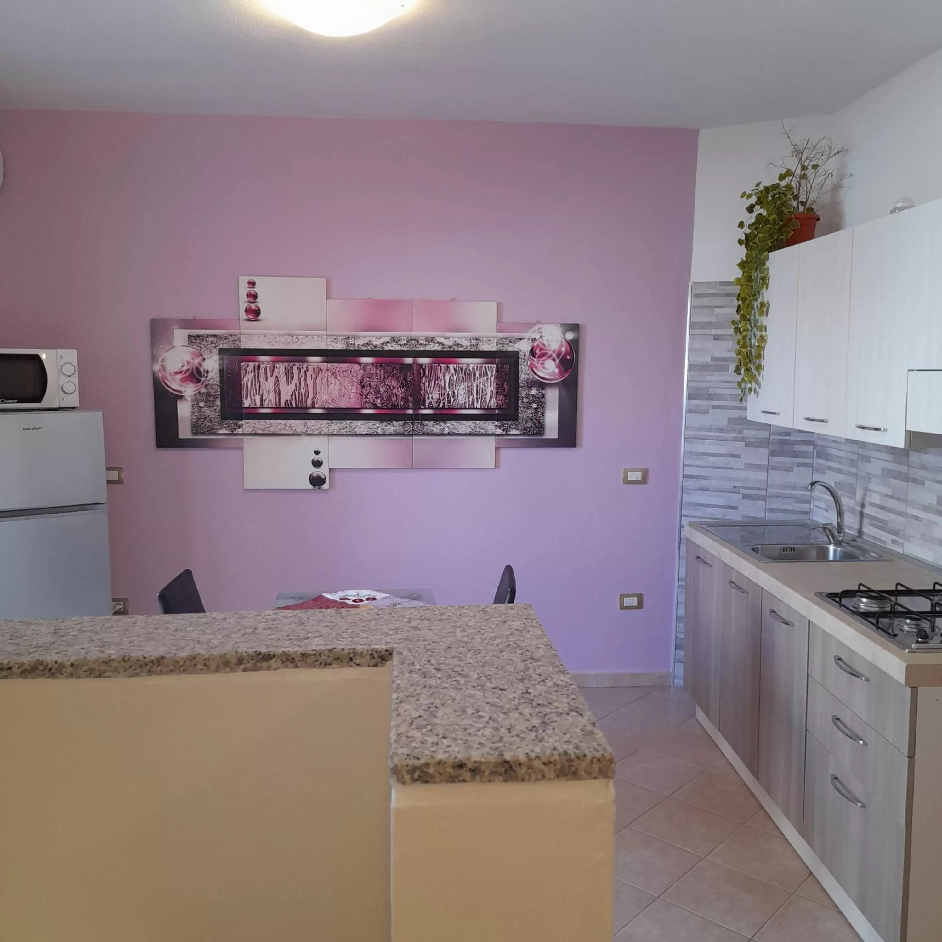 Kitchen or kitchenette in La Fortezza casa vacanze & appartament