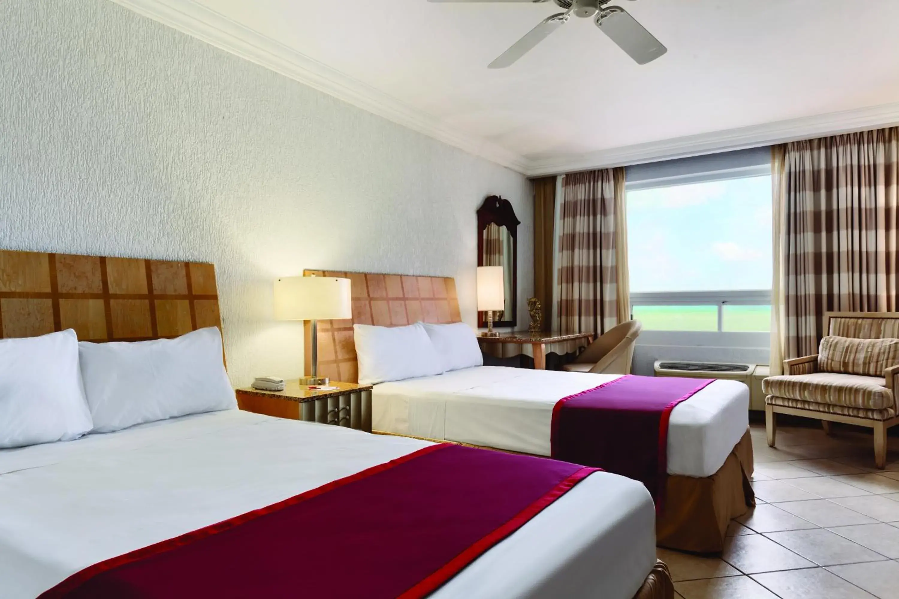 Bed in Ramada by Wyndham Princess Belize City