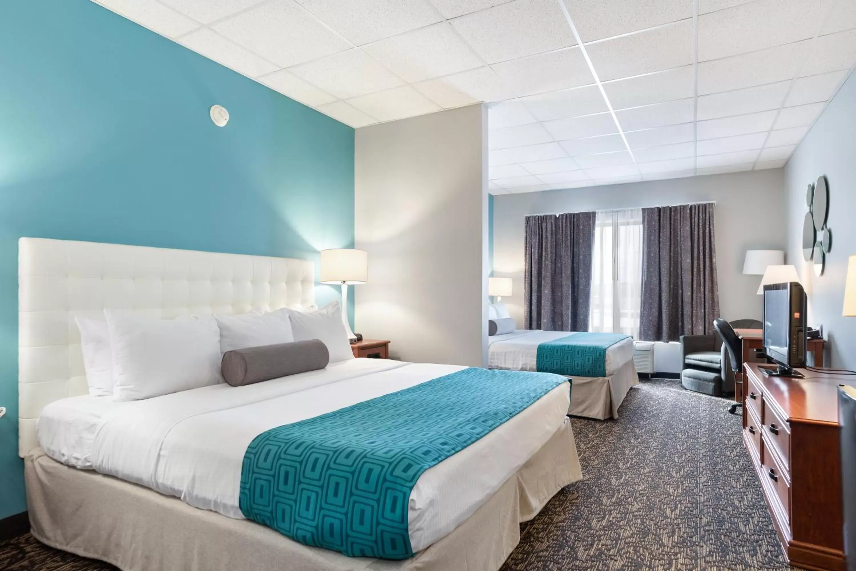 Bed in Howard Johnson by Wyndham Rapid City