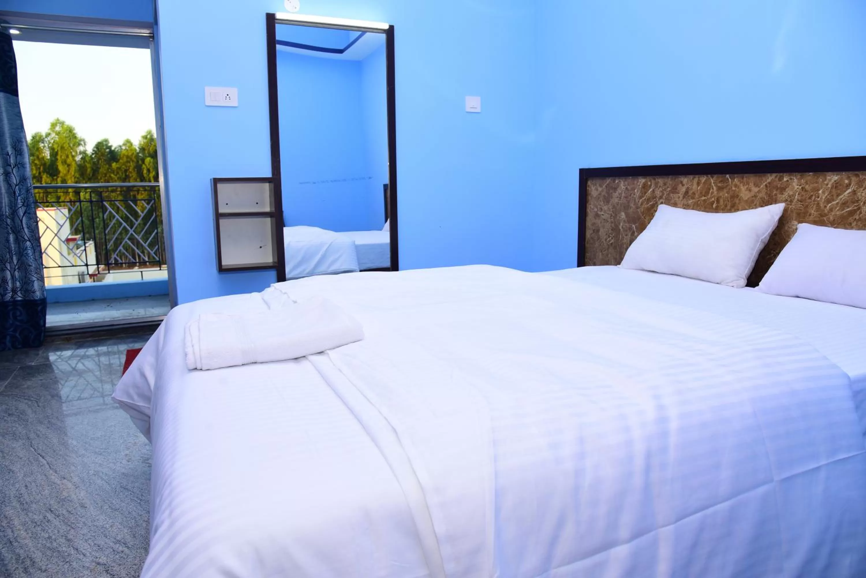 Bed in Thangam Residency