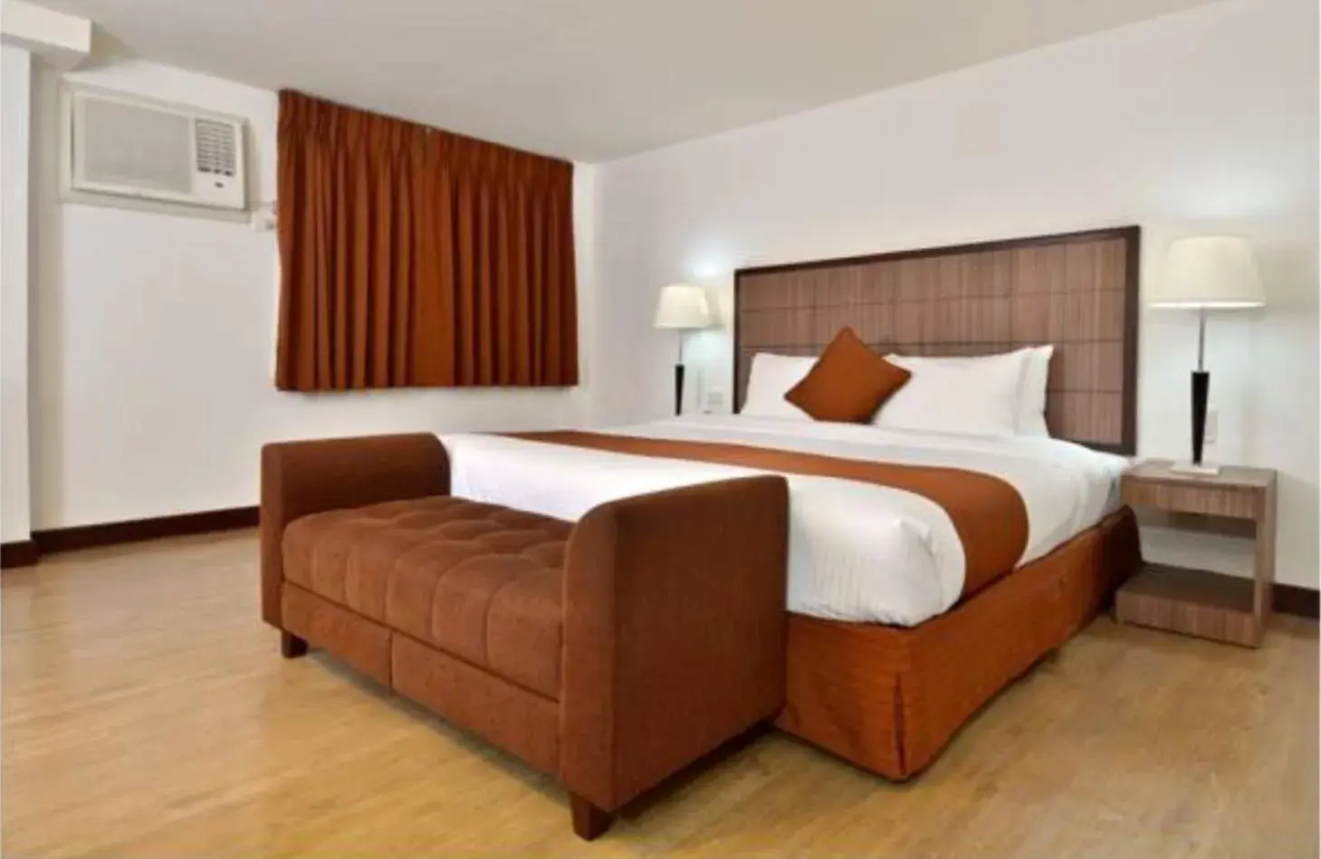 Bed in Tyche Boutique Hotel