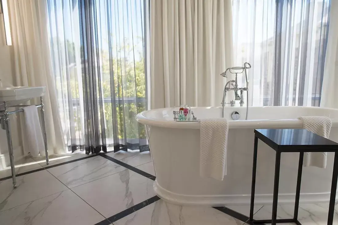 Bathroom in The Manor House at the Queen Victoria Hotel by NEWMARK