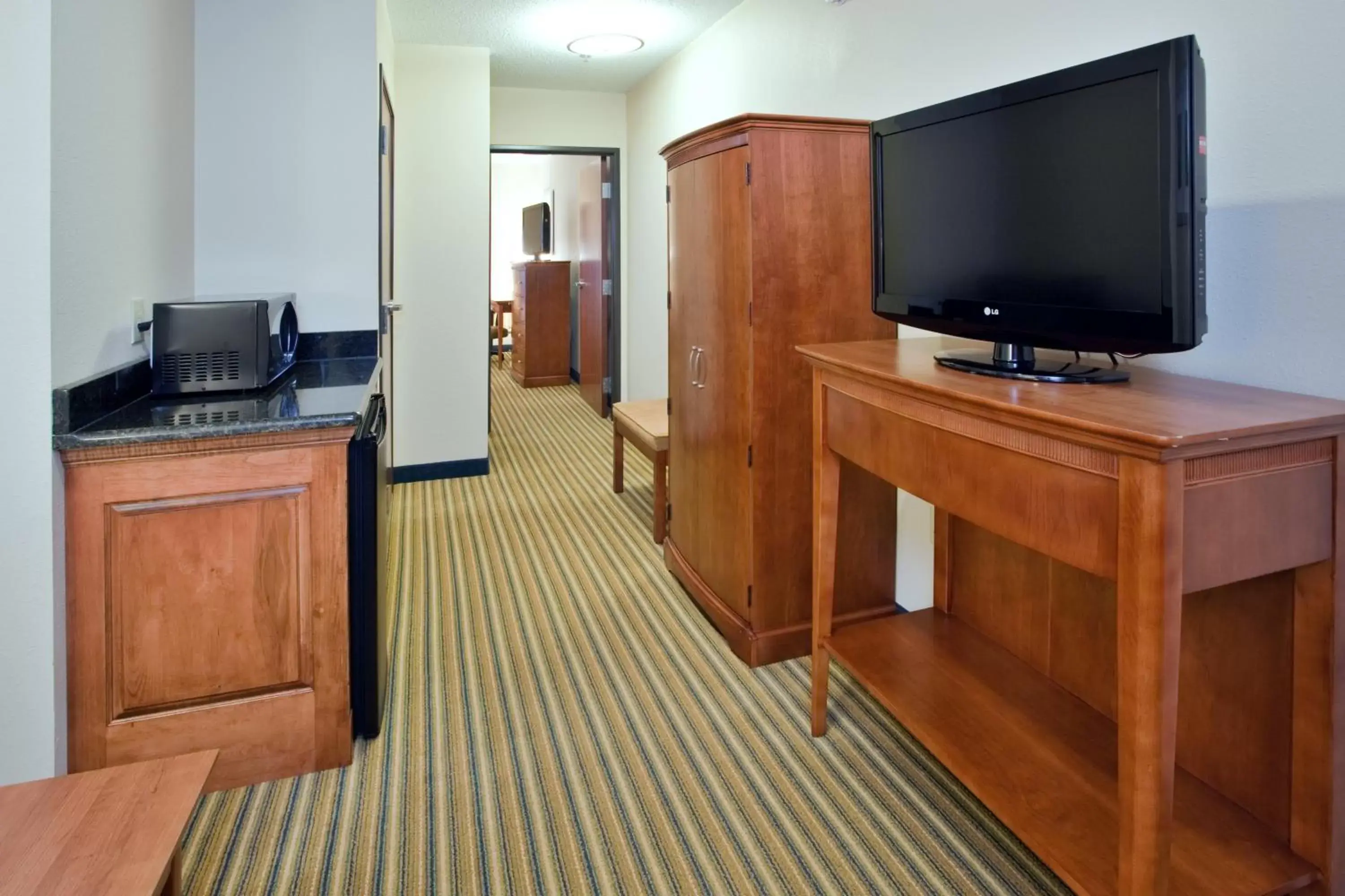 Photo of the whole room, TV/Entertainment Center in Holiday Inn Express Hotel & Suites Fredericksburg, an IHG Hotel