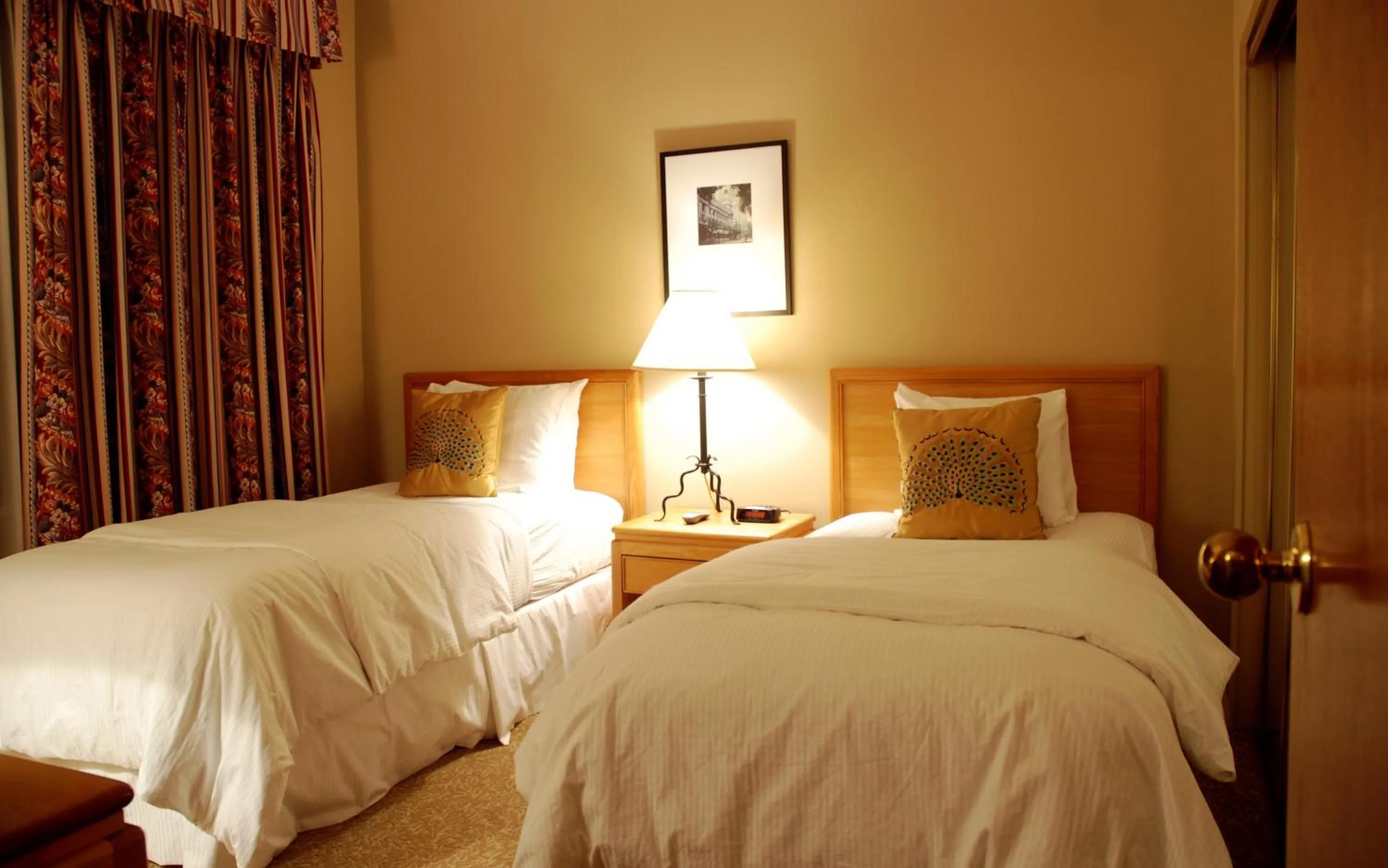 Bed in Rosellen Suites at Stanley Park