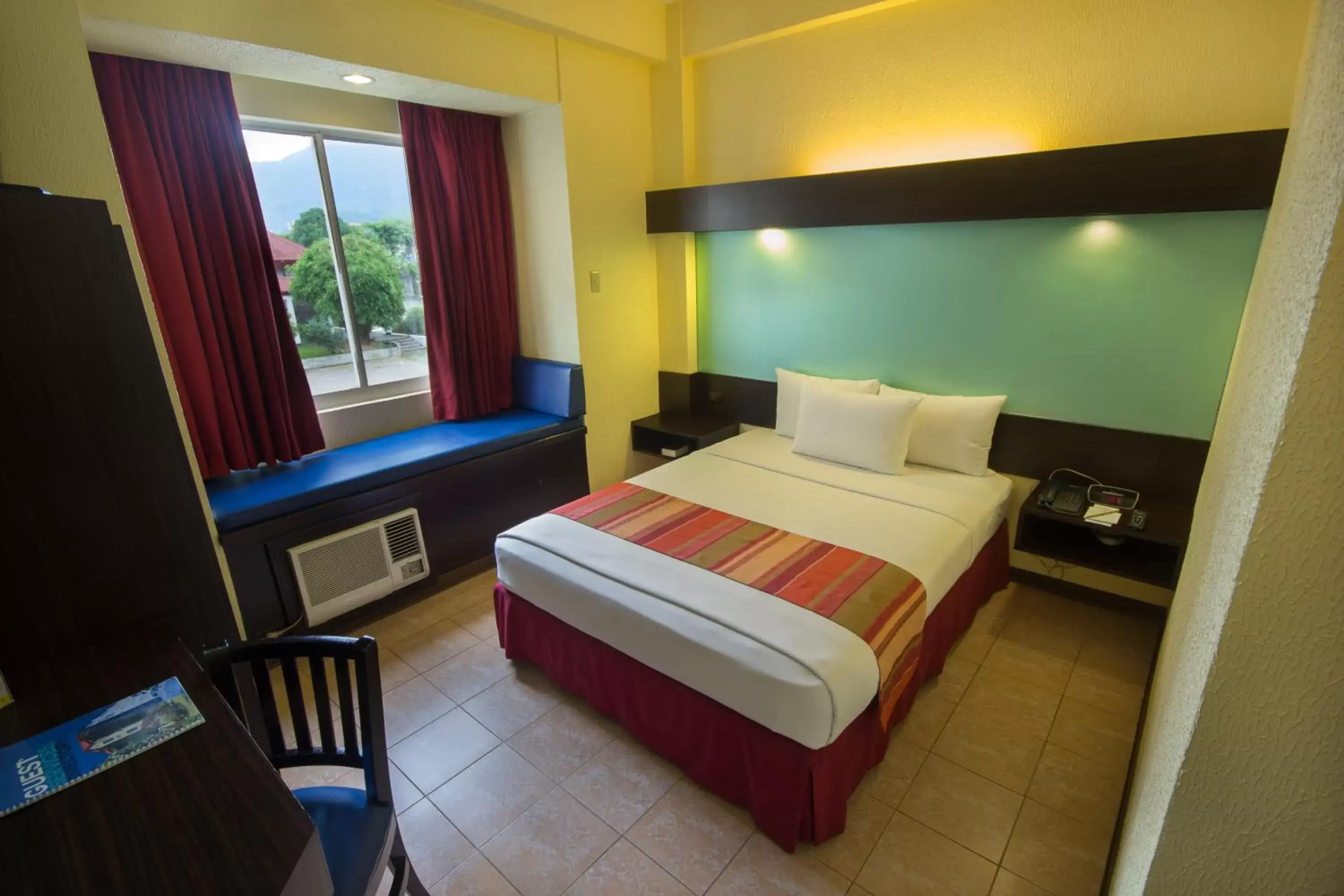 Bed in Microtel by Wyndham Batangas