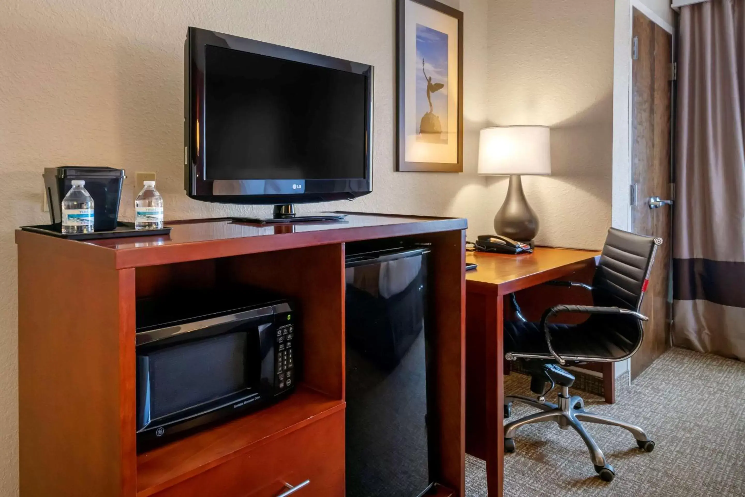 Photo of the whole room, TV/Entertainment Center in Comfort Suites West Jacksonville