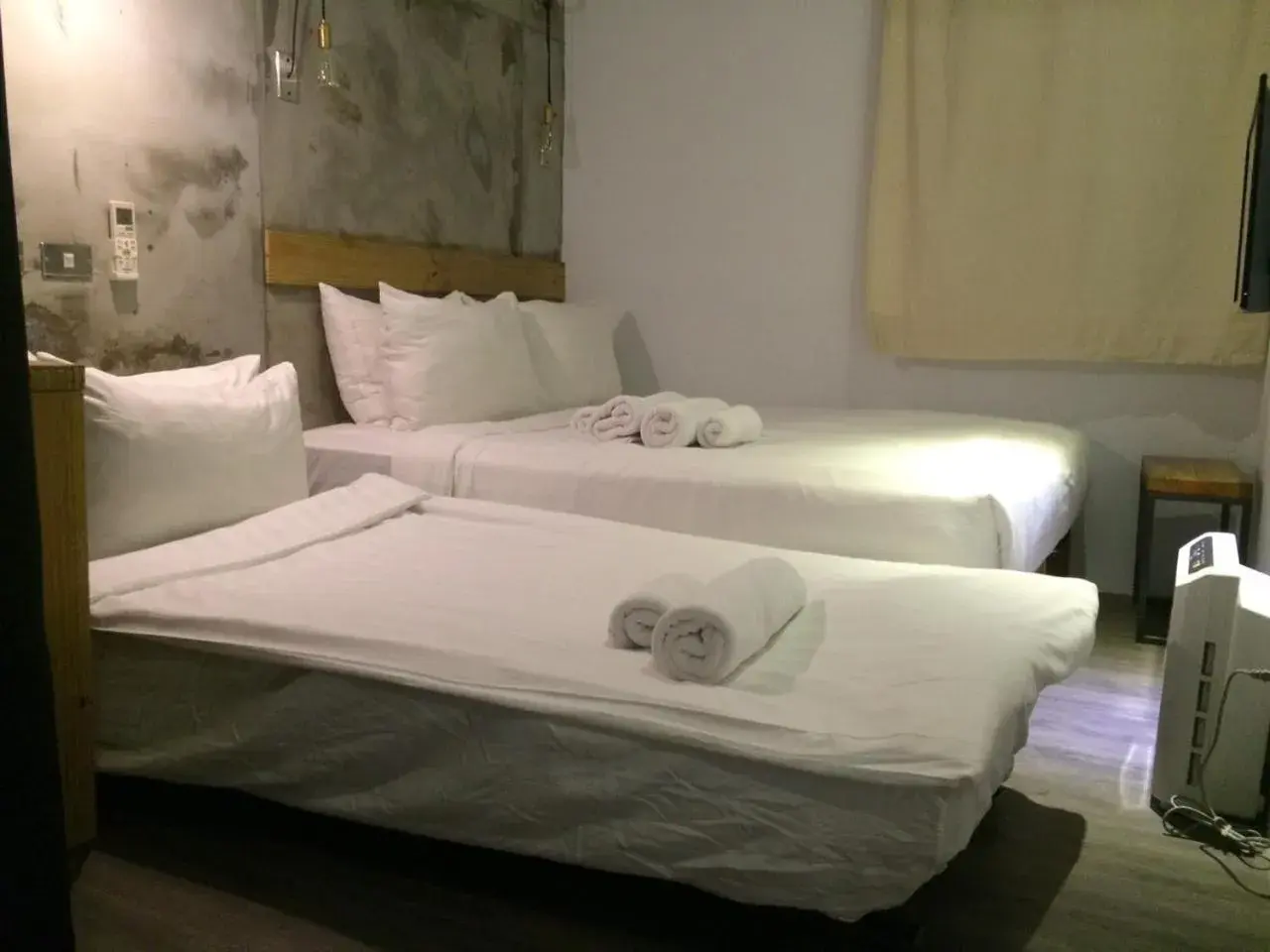 Bed in Just Inn Taipei