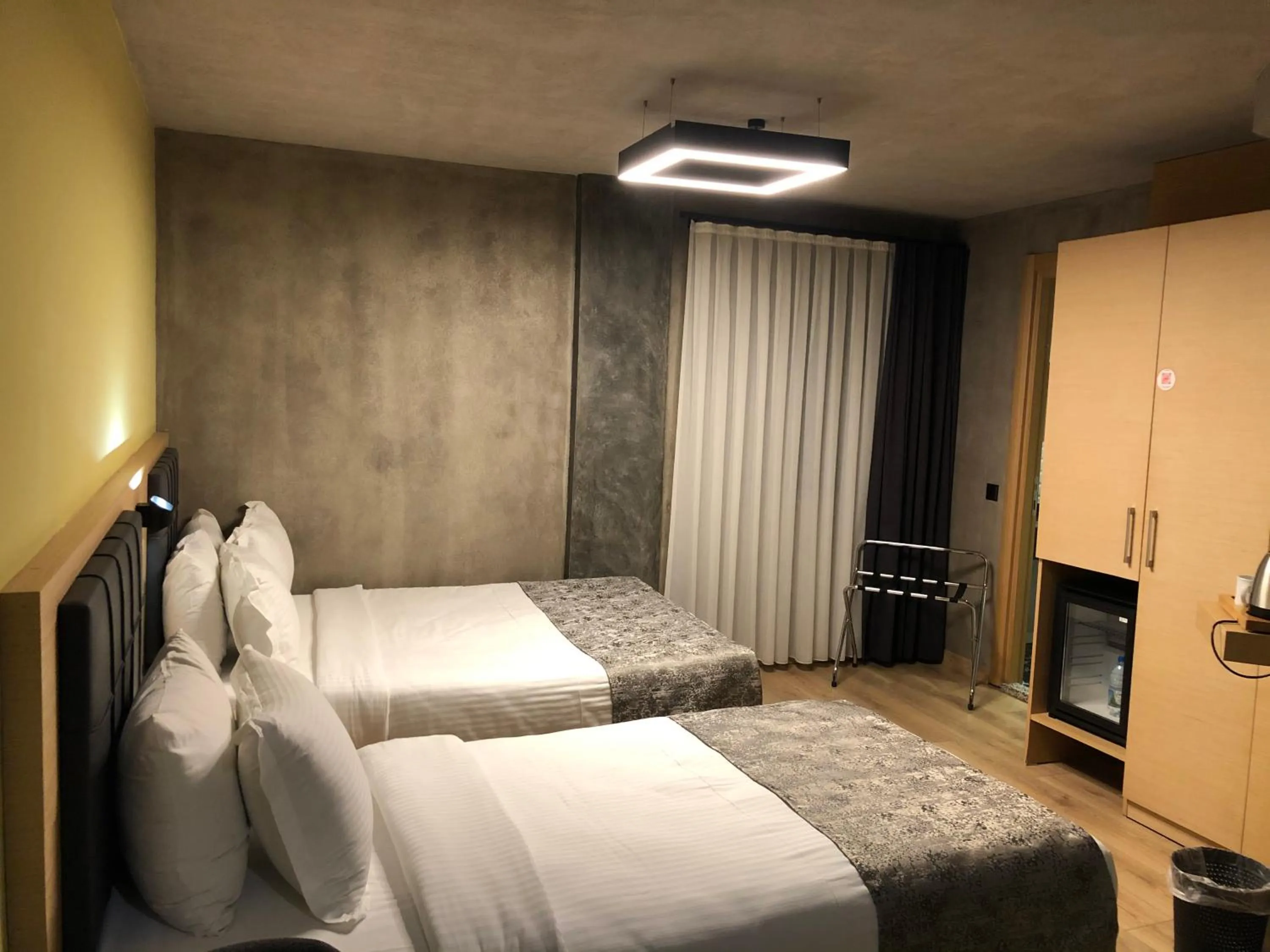 Bed in Red Stone Hotel