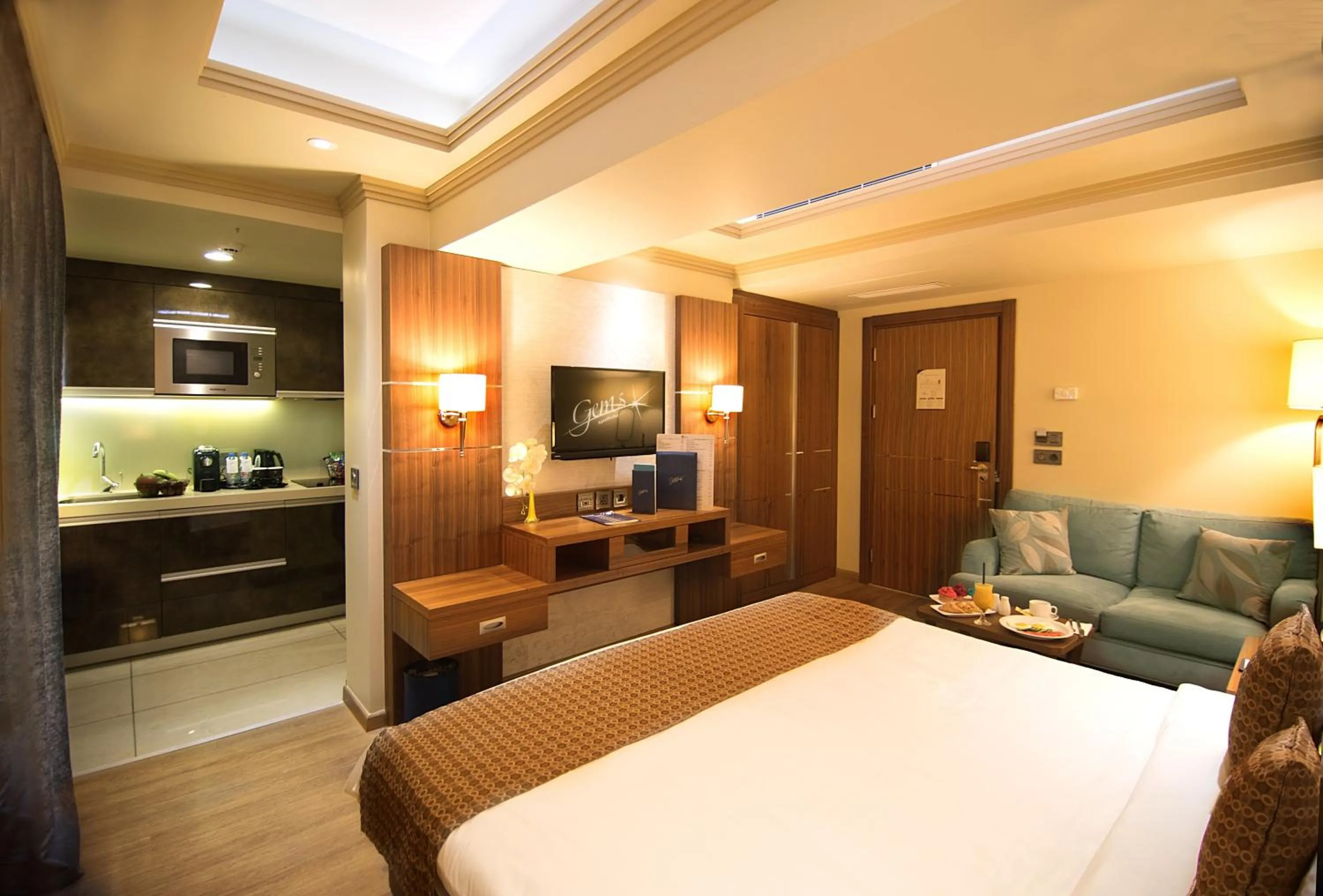 Living room, Bed in Gems Hotel