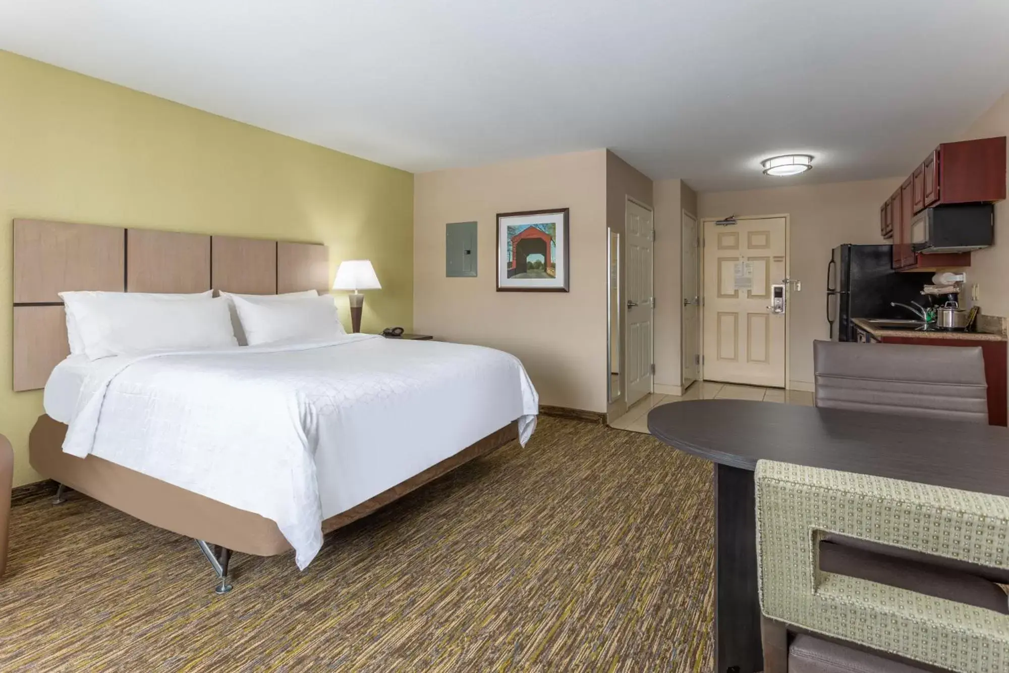 Bed in Candlewood Suites South Bend Airport, an IHG Hotel