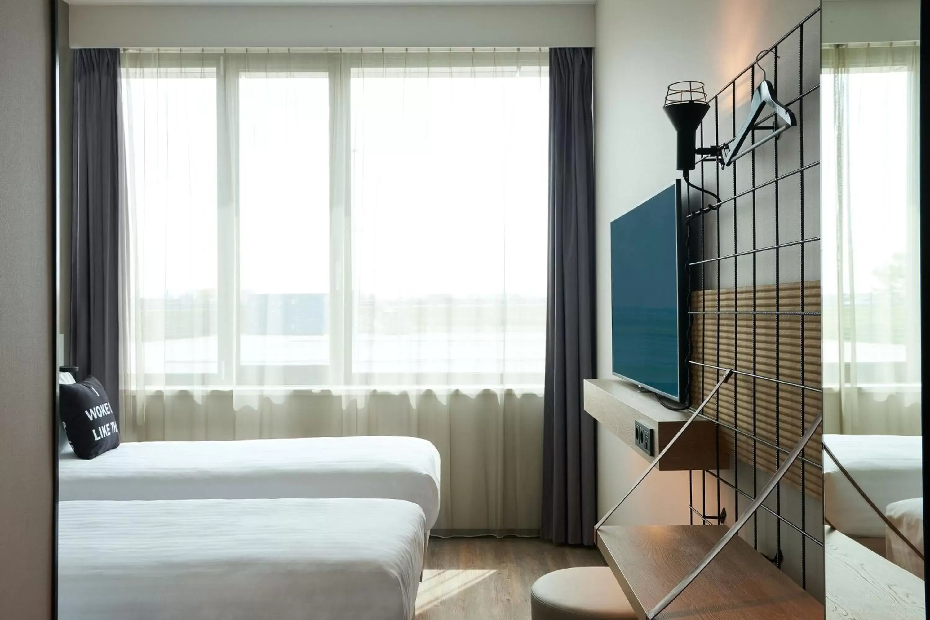 Photo of the whole room, Bed in Moxy Amsterdam Schiphol Airport