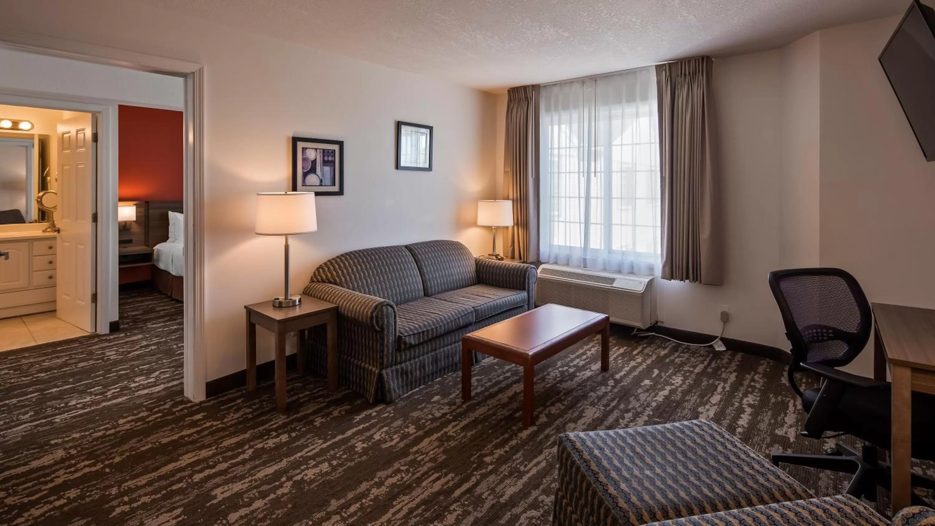 Living room in Charlevoix Inn & Suites SureStay Collection by Best Western