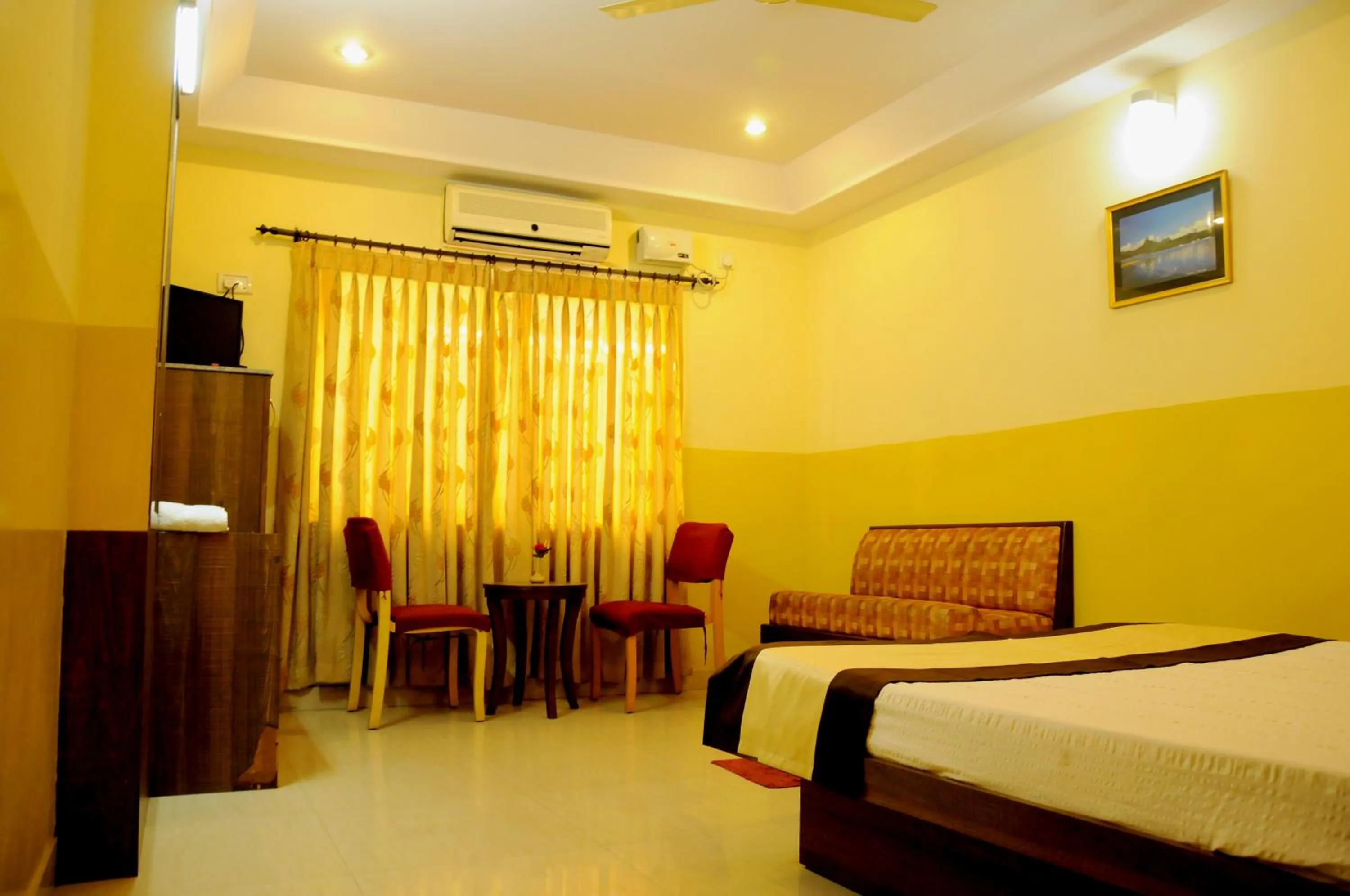 Photo of the whole room, Bed in Suvarna Residency