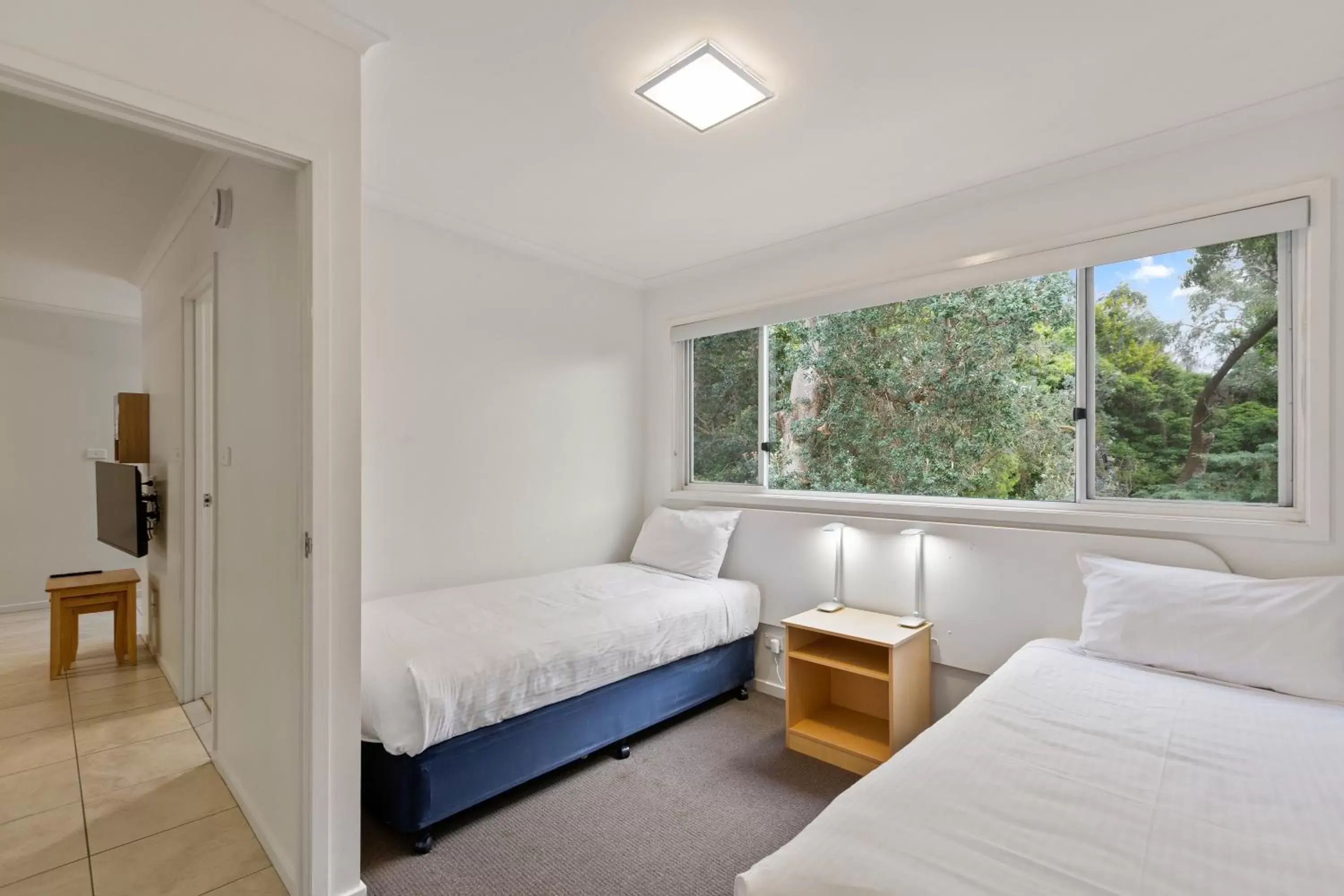 Bed in Tathra Beach House Holiday Apartments