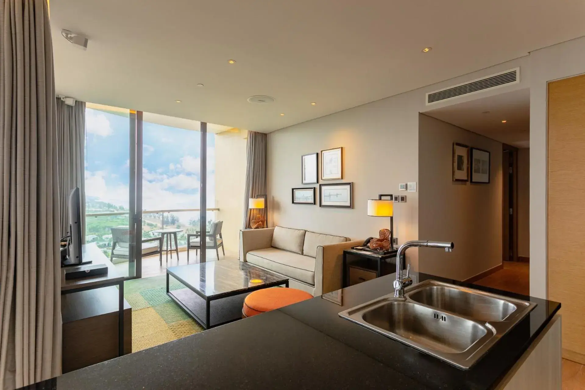 Living room, Kitchen/Kitchenette in InterContinental Phu Quoc Long Beach Resort, an IHG Hotel