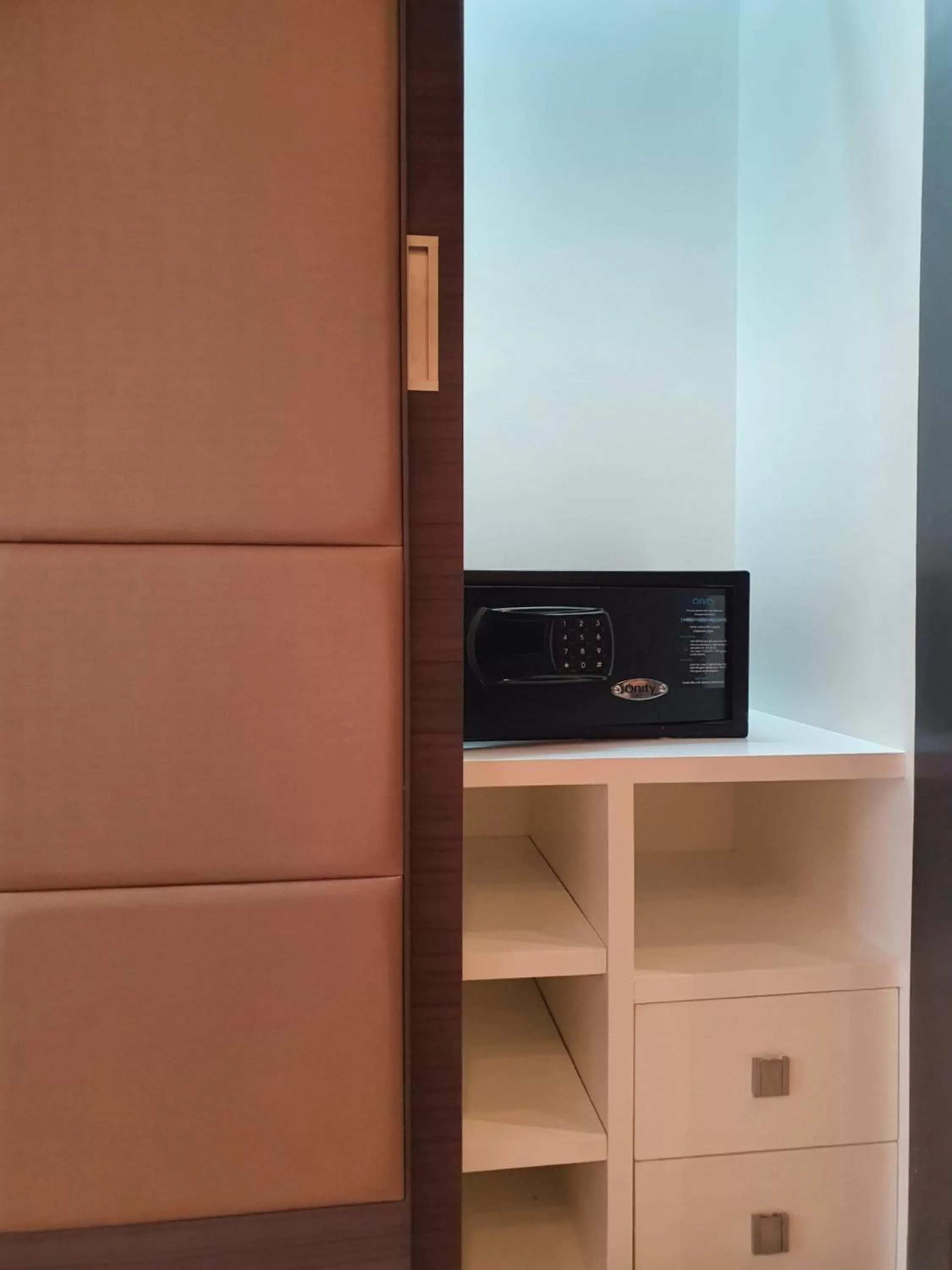 safe, TV/Entertainment Center in Amora NeoLuxe Suites Hotel