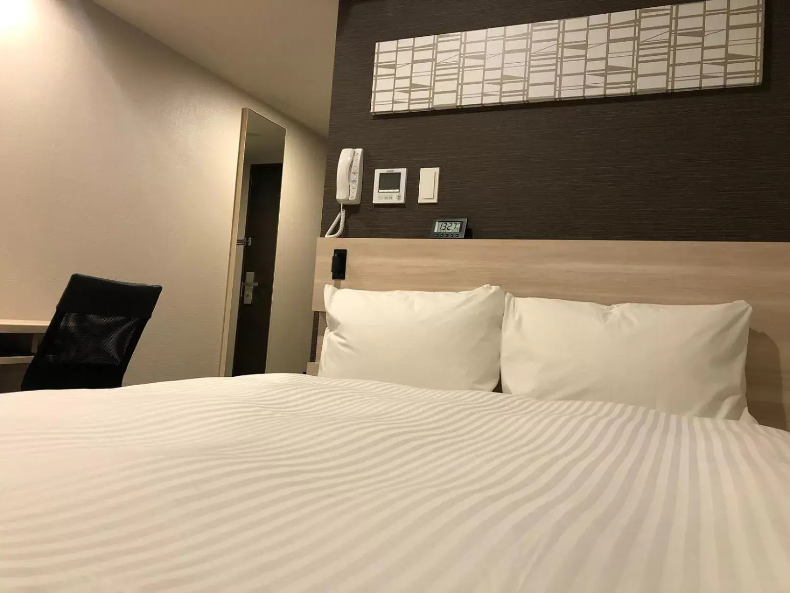 Bed in Smile Hotel Osaka Nakanoshima