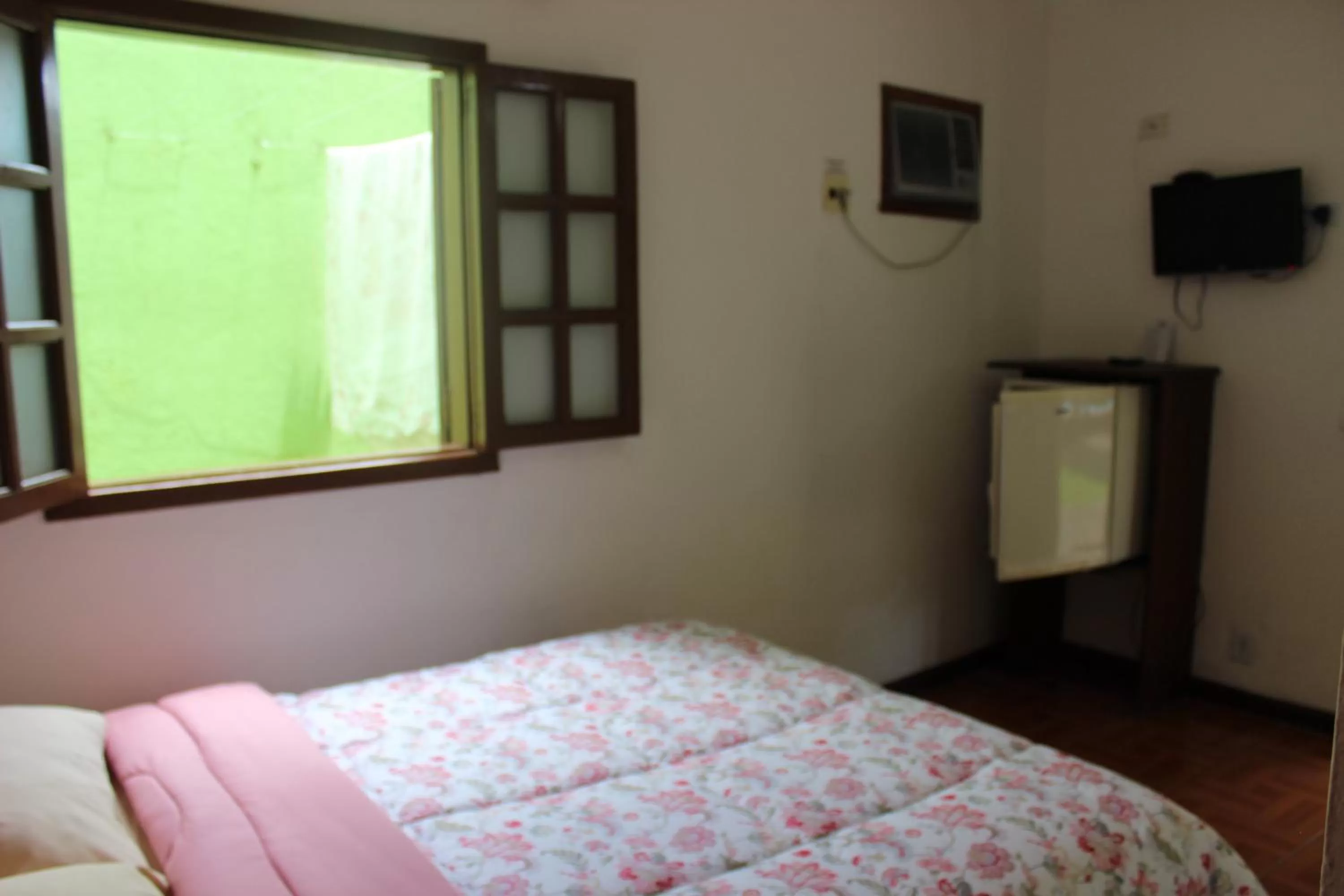 Bed in Pousada Flor de Paraty