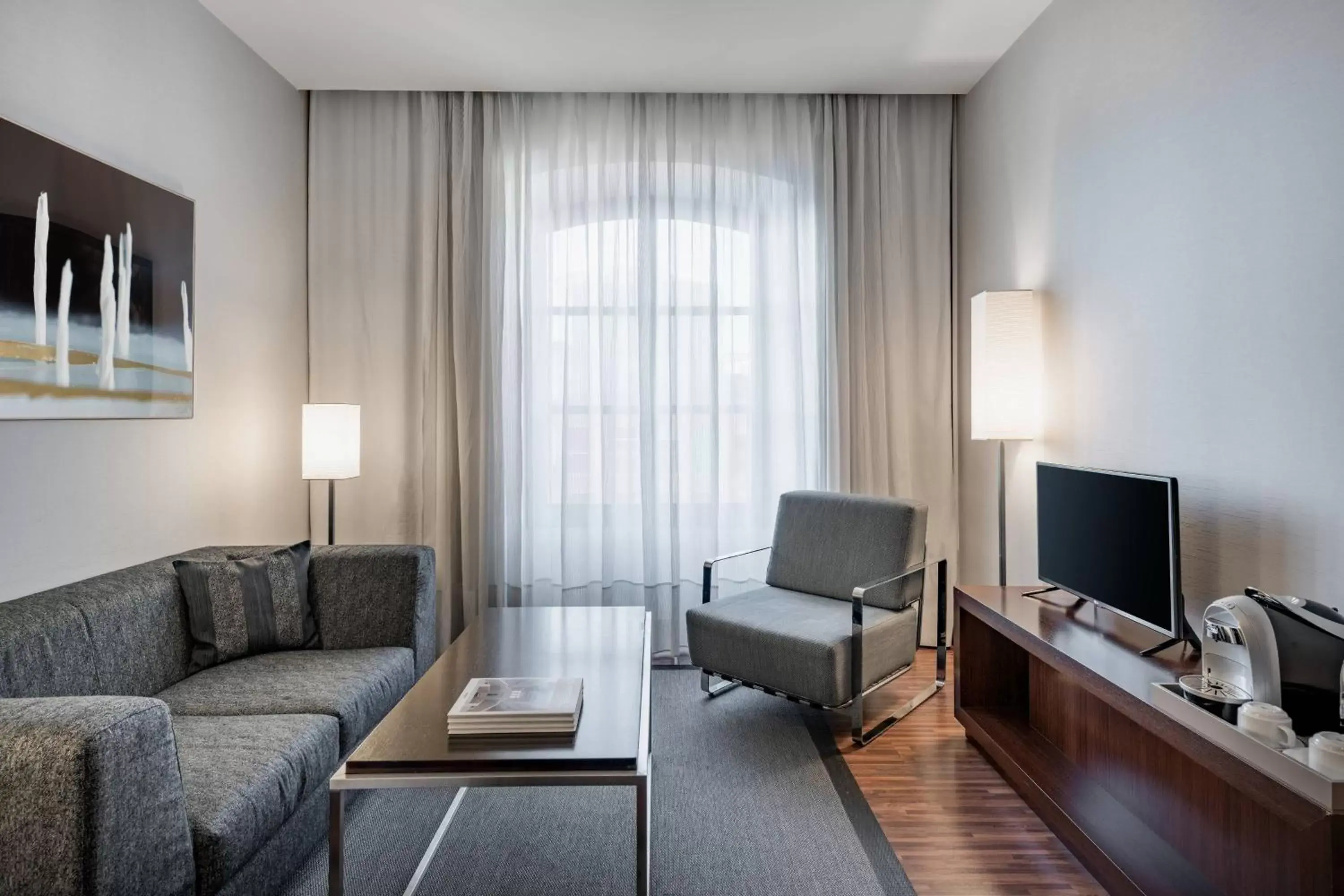 Photo of the whole room, Seating Area in AC Hotel Torino by Marriott