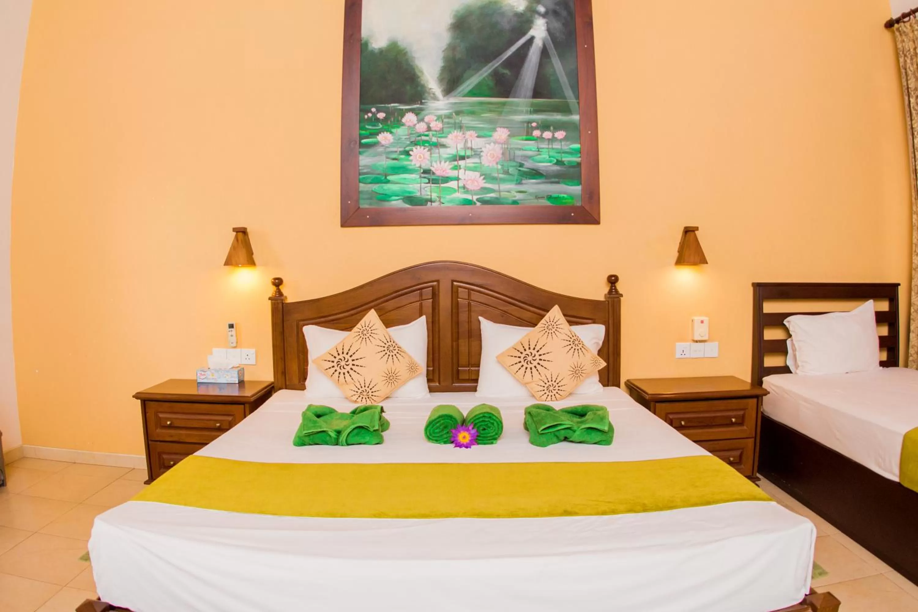 Bed in Jasmin Villa Ayurveda Resort
