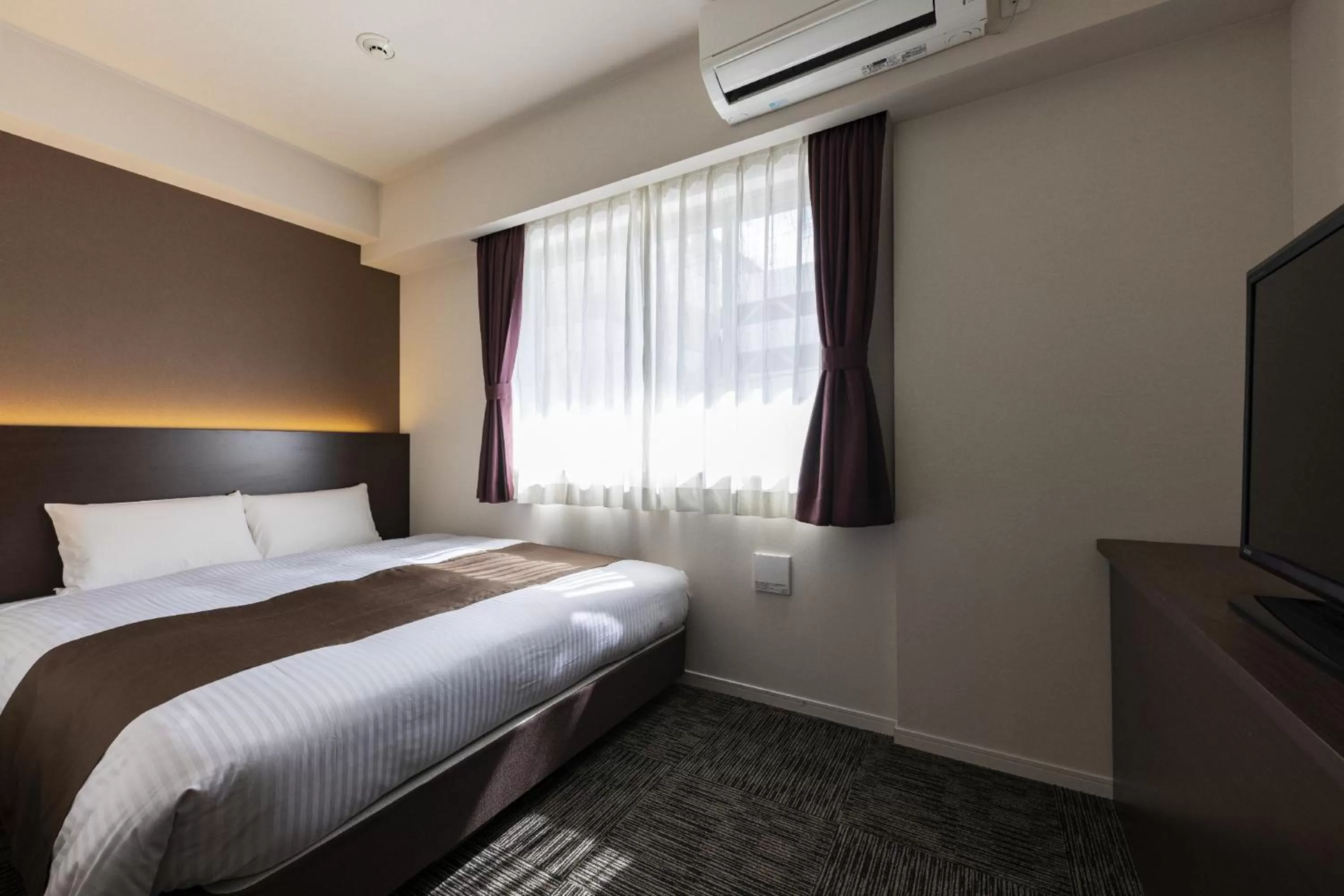 Photo of the whole room, Bed in KOKO HOTEL Osaka Shinsekai - formerly Hotel Wing Premium Osaka Shinsekai