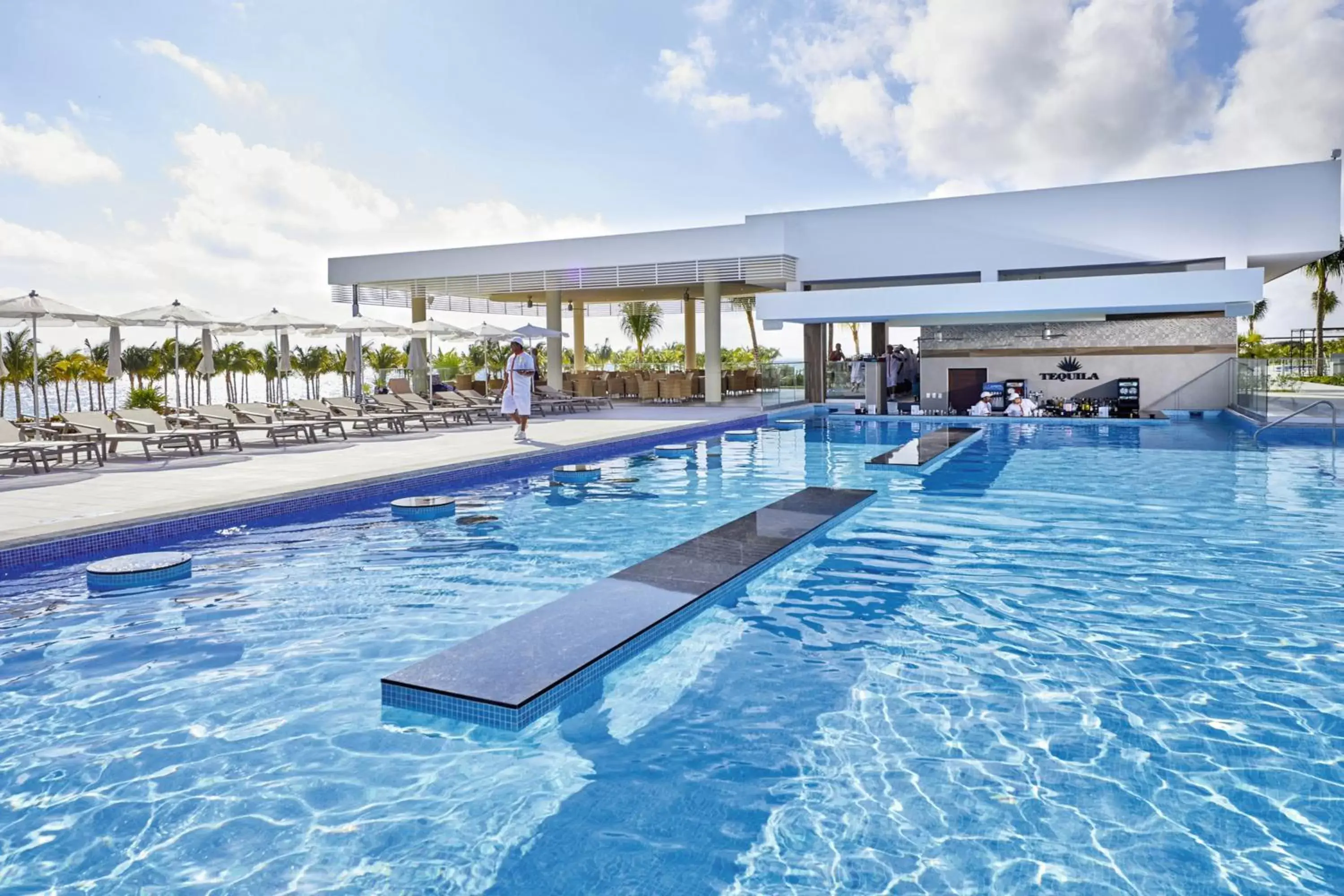 Lounge or bar, Swimming Pool in Riu Palace Costa Mujeres - All Inclusive