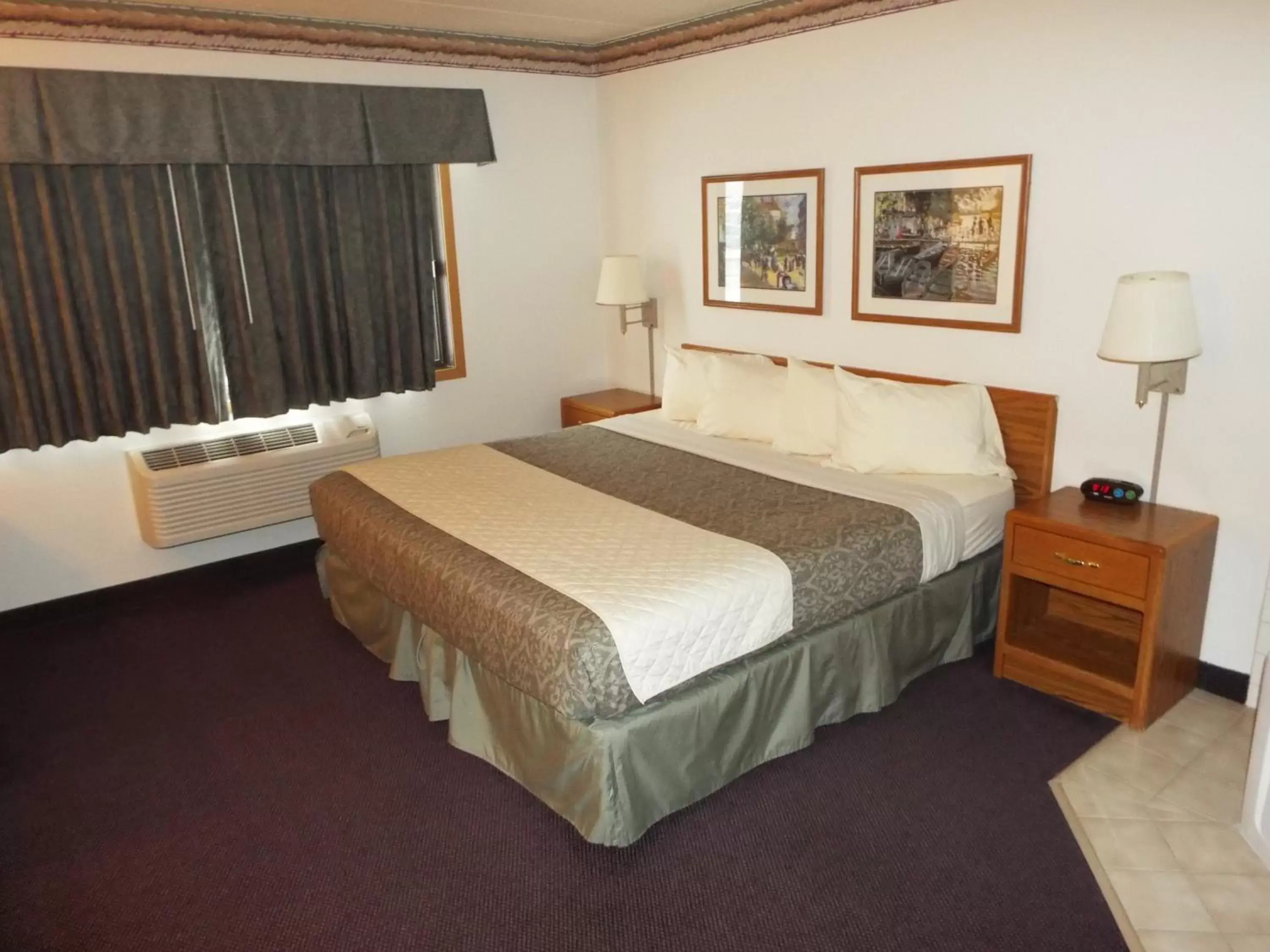 Bed in FairBridge Inn & Suites
