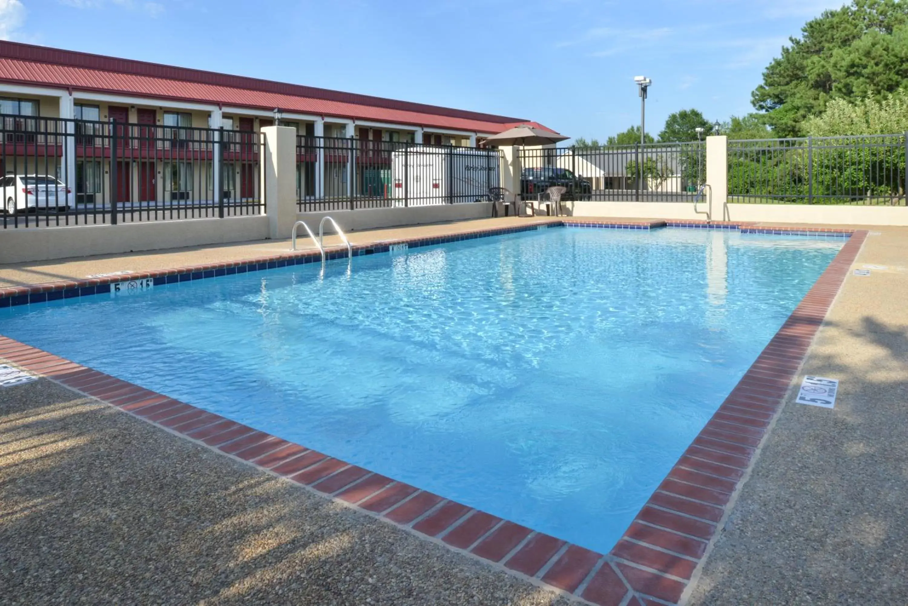 Swimming Pool in Americas Best Value Inn Tupelo Barnes Crossing