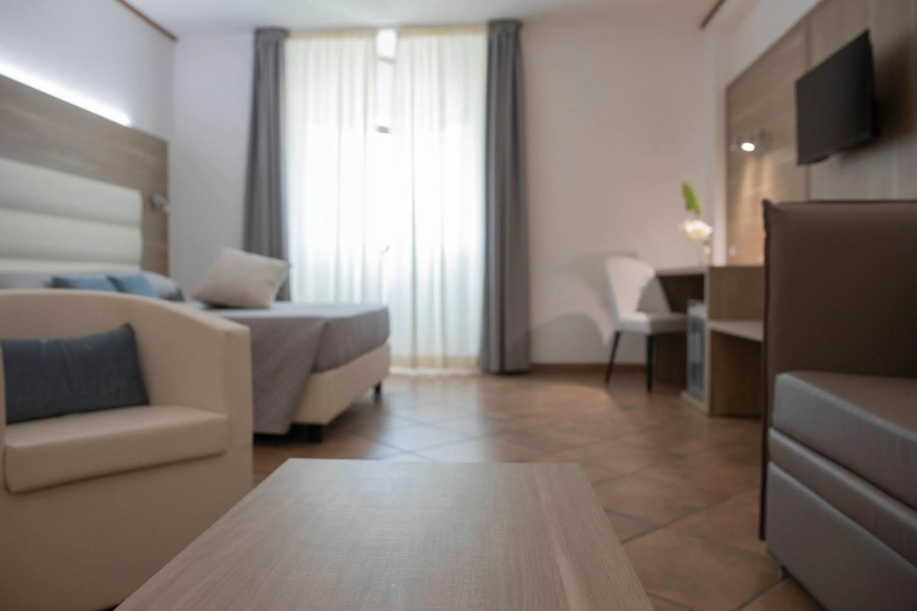 Living room, Bed in Pegasus Hotel