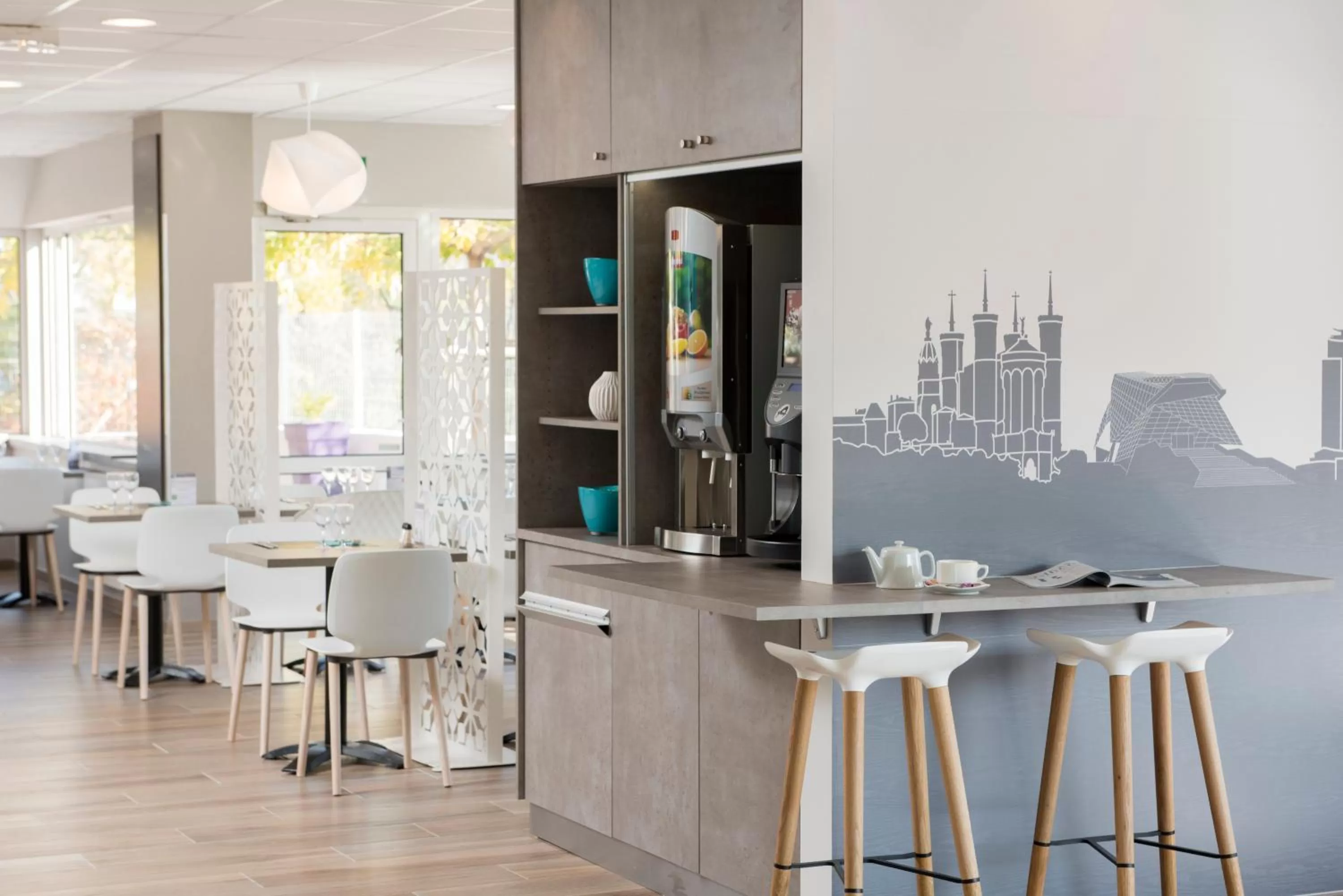 Communal lounge/ TV room in Kyriad Hotel Lyon Givors